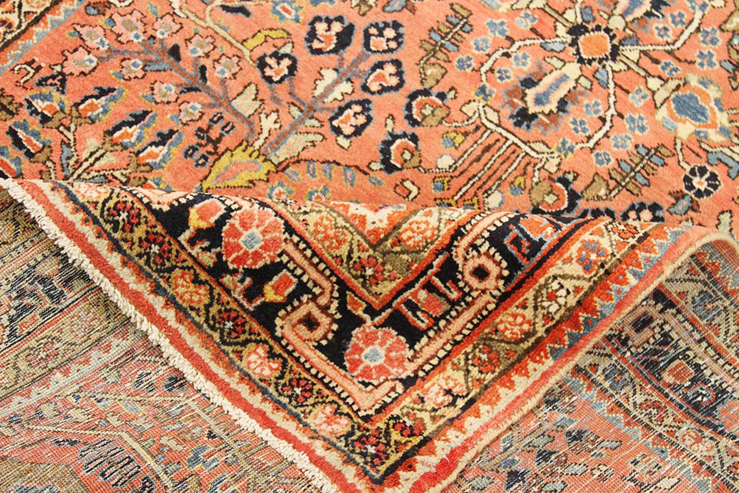 Sarouk Farahan Antique Persian Sarouk Rug with Red & Navy Floral Details on Pink Field For Sale