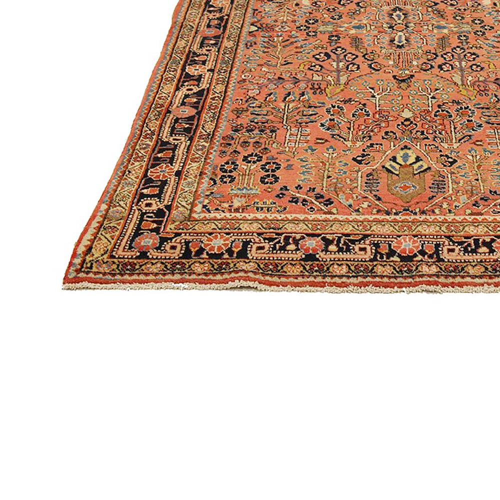 Hand-Woven Antique Persian Sarouk Rug with Red & Navy Floral Details on Pink Field For Sale