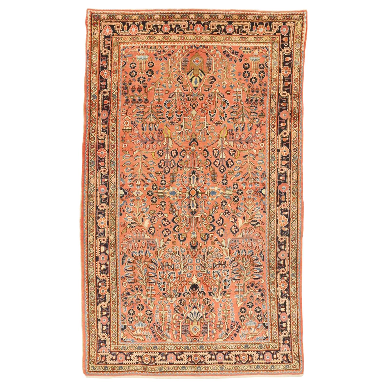 Antique Persian Sarouk Rug with Red & Navy Floral Details on Pink Field For Sale
