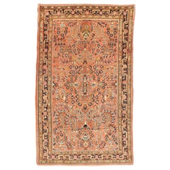 Tapis sarouk persan ancien avec des détails floraux rouges & sur fond rose