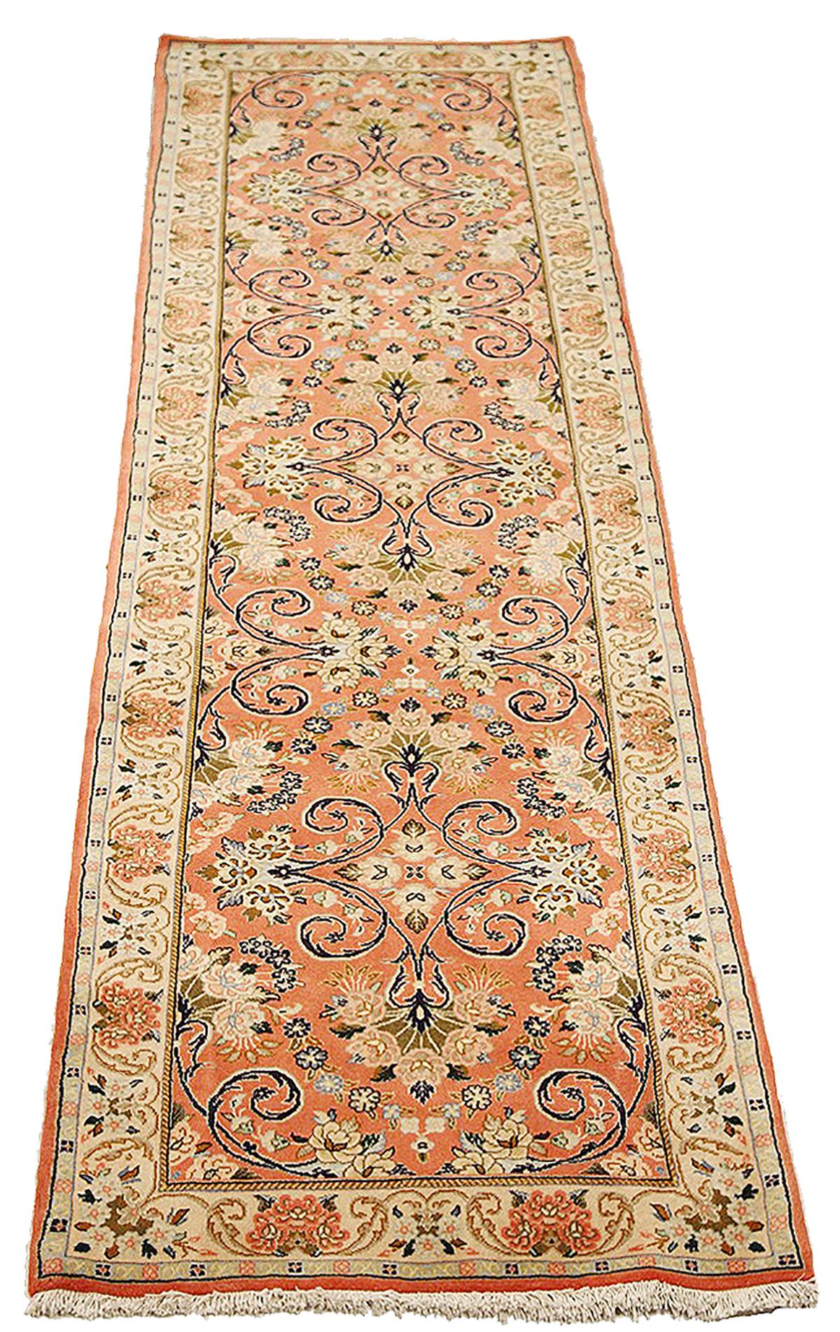 Persian rug handwoven from the finest sheep’s wool and colored with all-natural vegetable dyes that are safe for humans and pets. It’s a traditional Sarouk design featuring floral details using a lovely mix of navy and ivory. It has a pink center