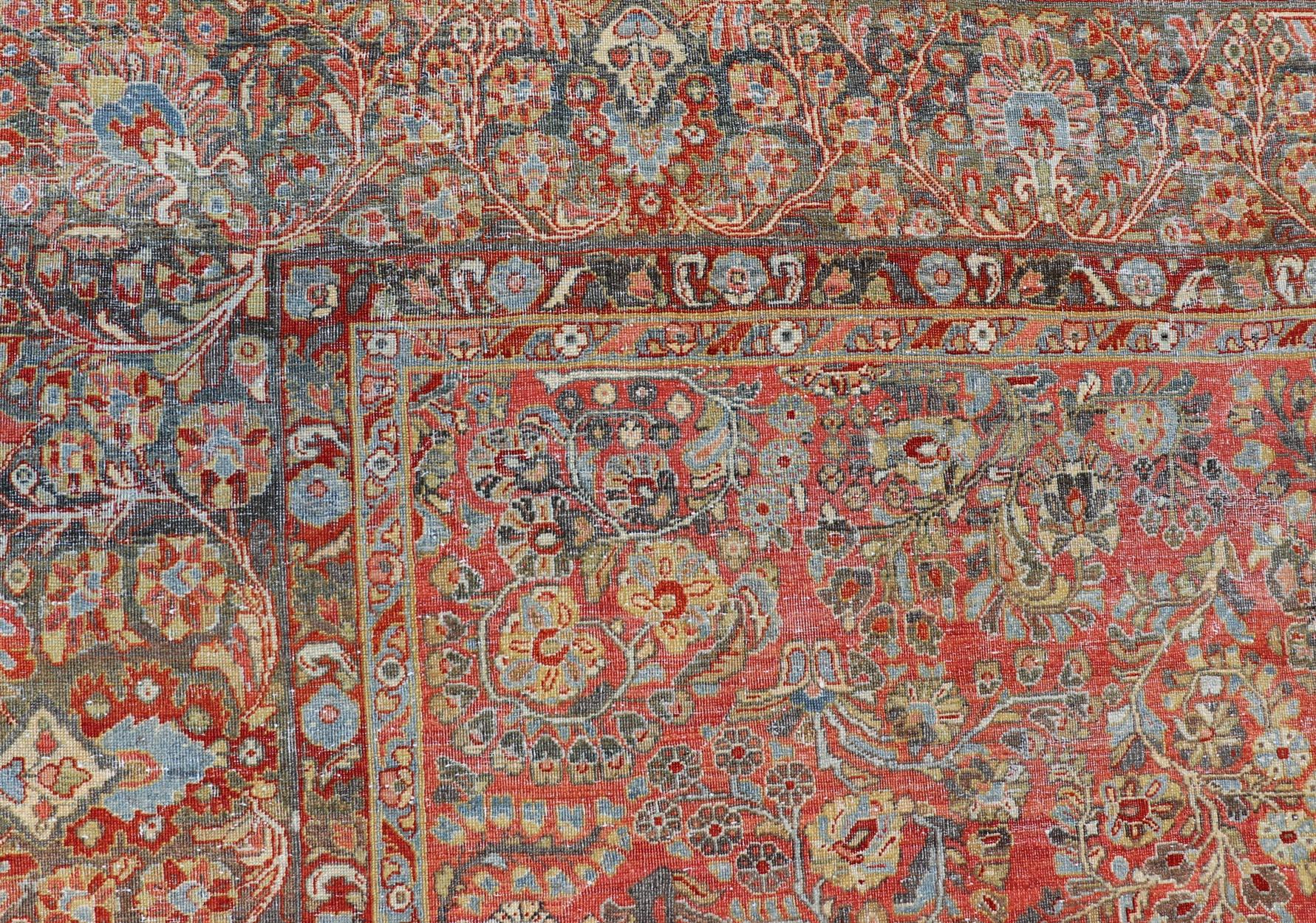 Antique Persian Sarouk with all-over floral design on a light red field 
Keivan Woven Arts / J10-1101, country of origin / type: Iran / Sarouk circa 1920
Measures: 10'2 x 13'3 
This wonderful, early 20th century Persian Sarouk carpet features a