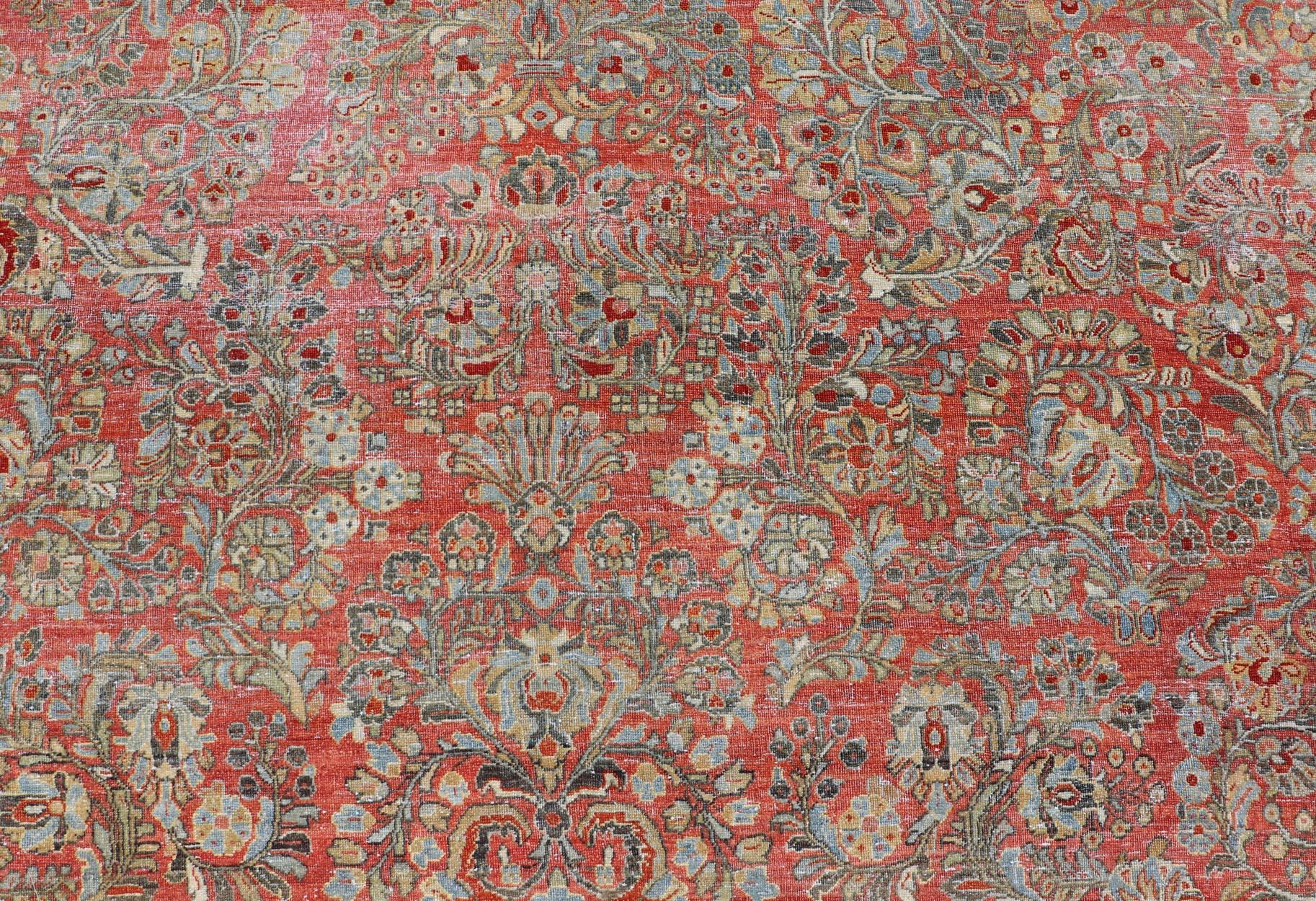 Antique Persian Sarouk with All-Over Floral Design on a Light Red Field In Good Condition For Sale In Atlanta, GA