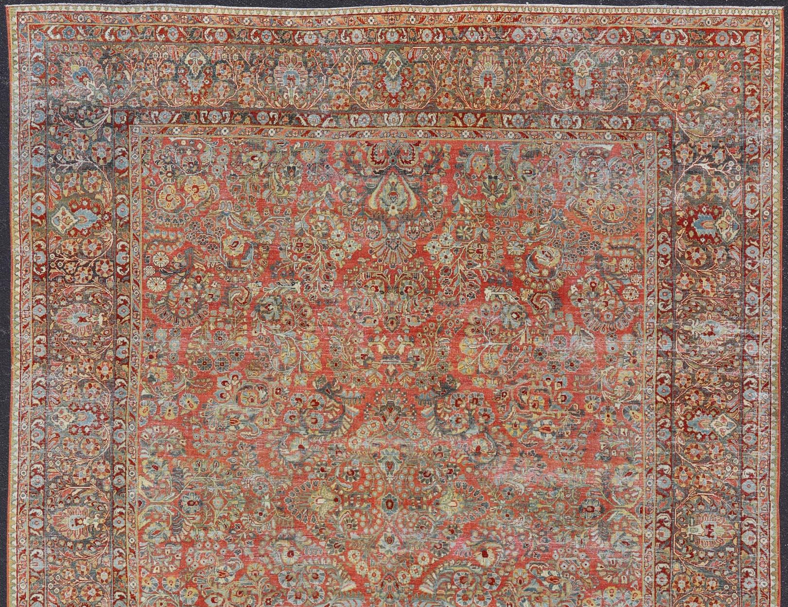 Wool Antique Persian Sarouk with All-Over Floral Design on a Light Red Field For Sale