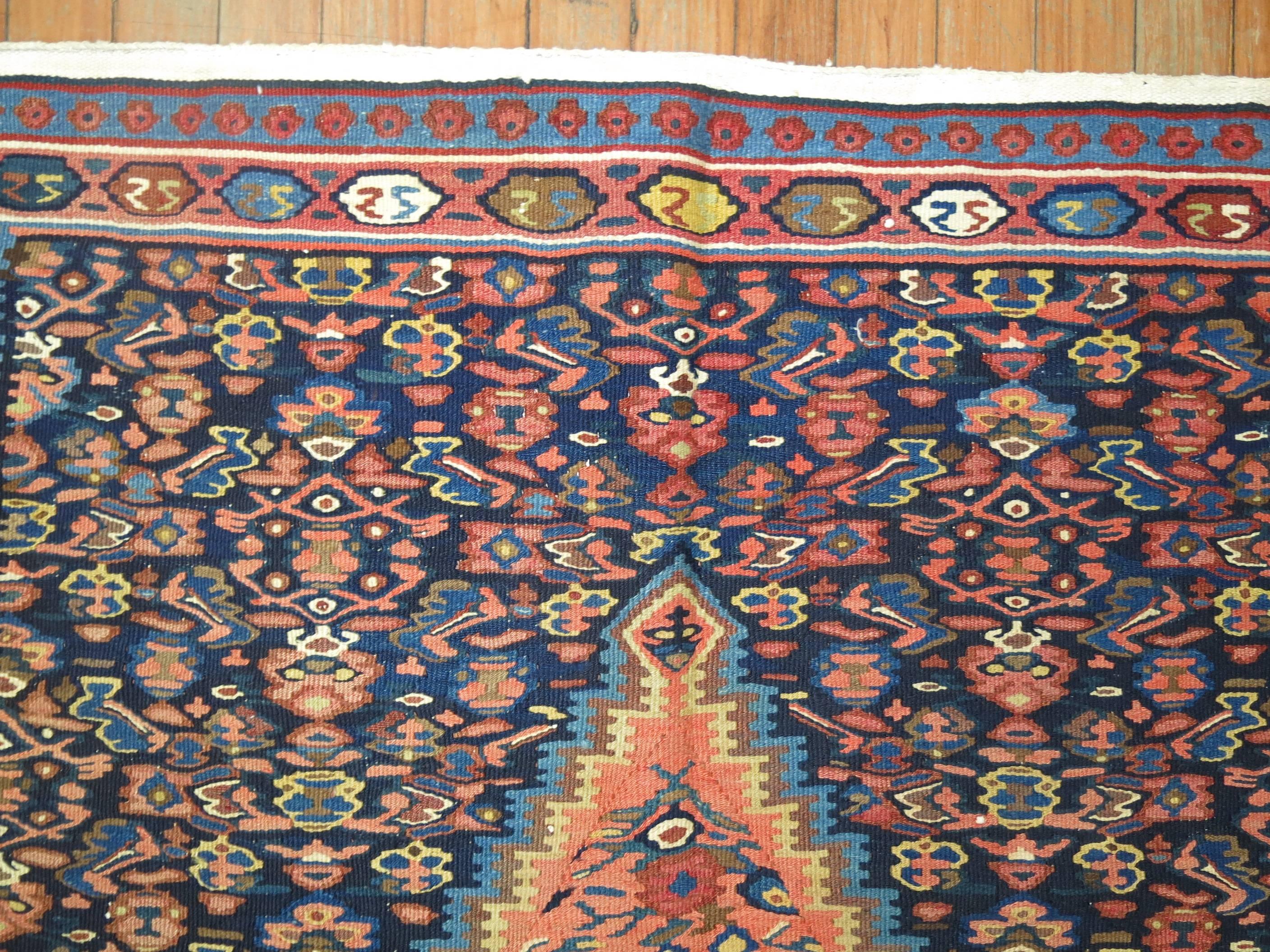 A fine example of an early 20th century Persian Senneh flat-weave Kilim rug.

3'9'' x 5'3''