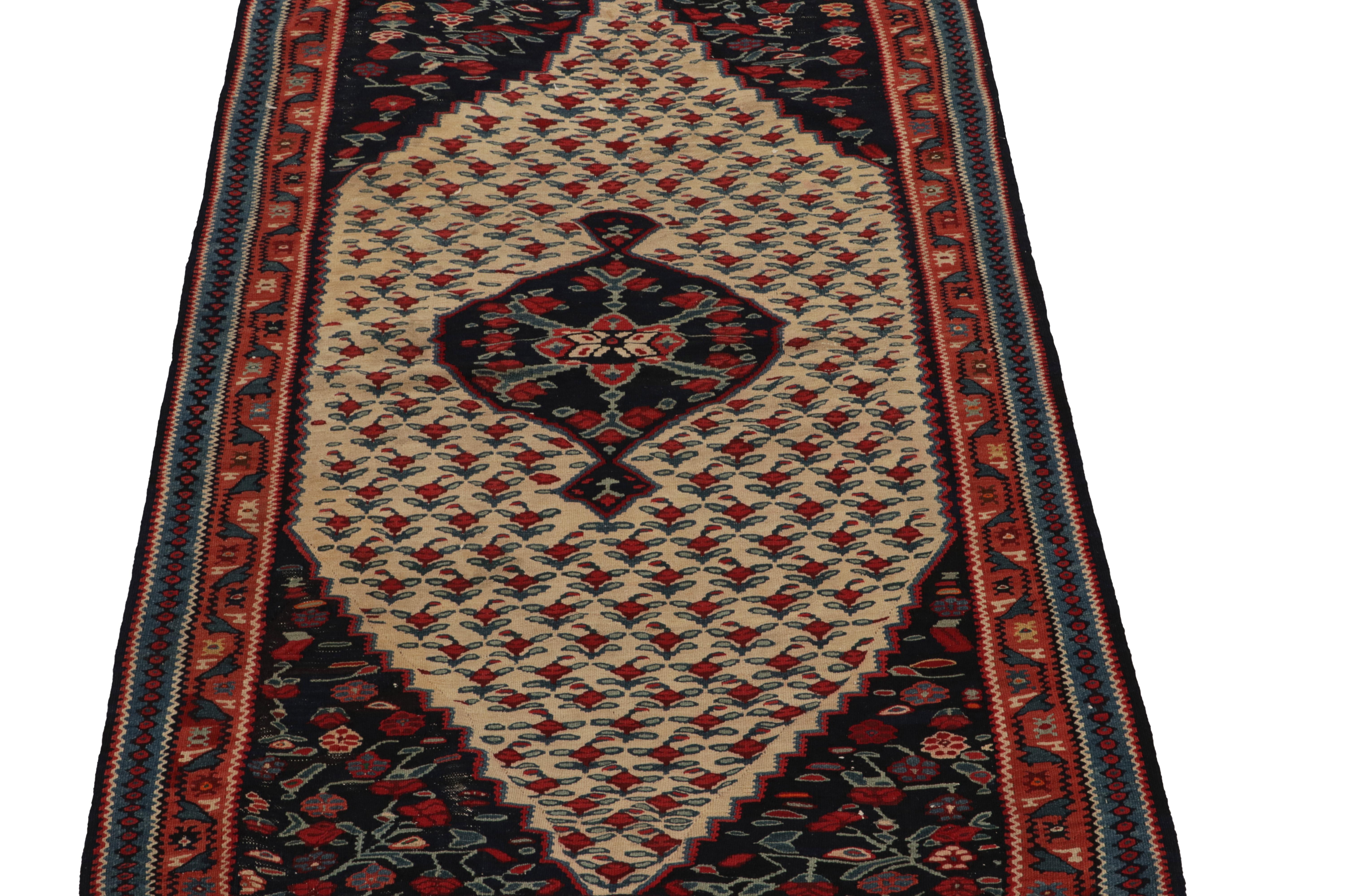 Hand-Knotted Antique Persian Senneh Kilim in Beige with Red Floral Patterns by Rug & Kilim For Sale