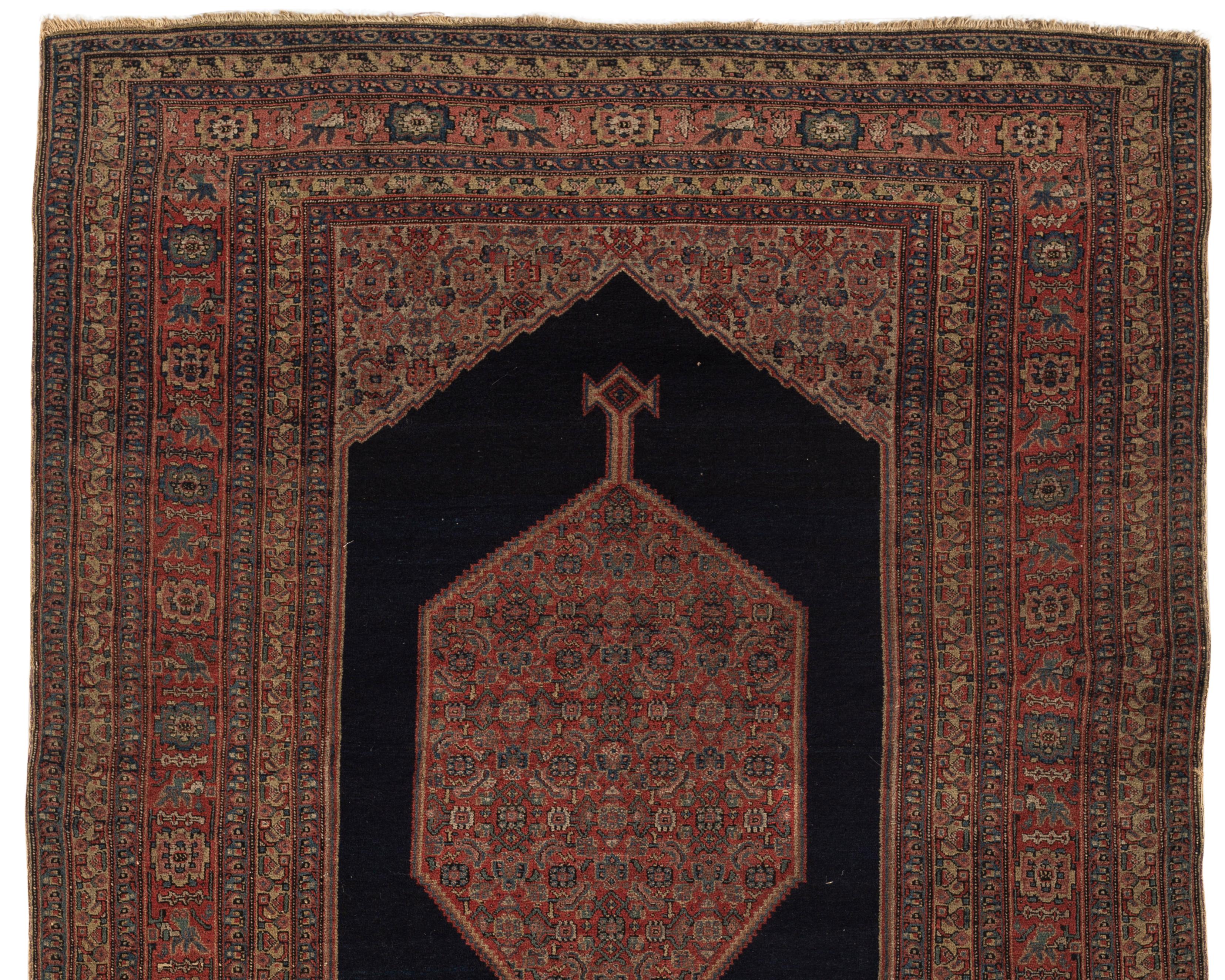 Antique Persian Senneh rug, circa 1880, size: 4'7 x 6'7. From the town of Senha (Sanandaj) in Kurdistan come antique rugs that attain nearly miraculous fineness and suppleness. A central deep navy diamond enclosing a floral design filled center