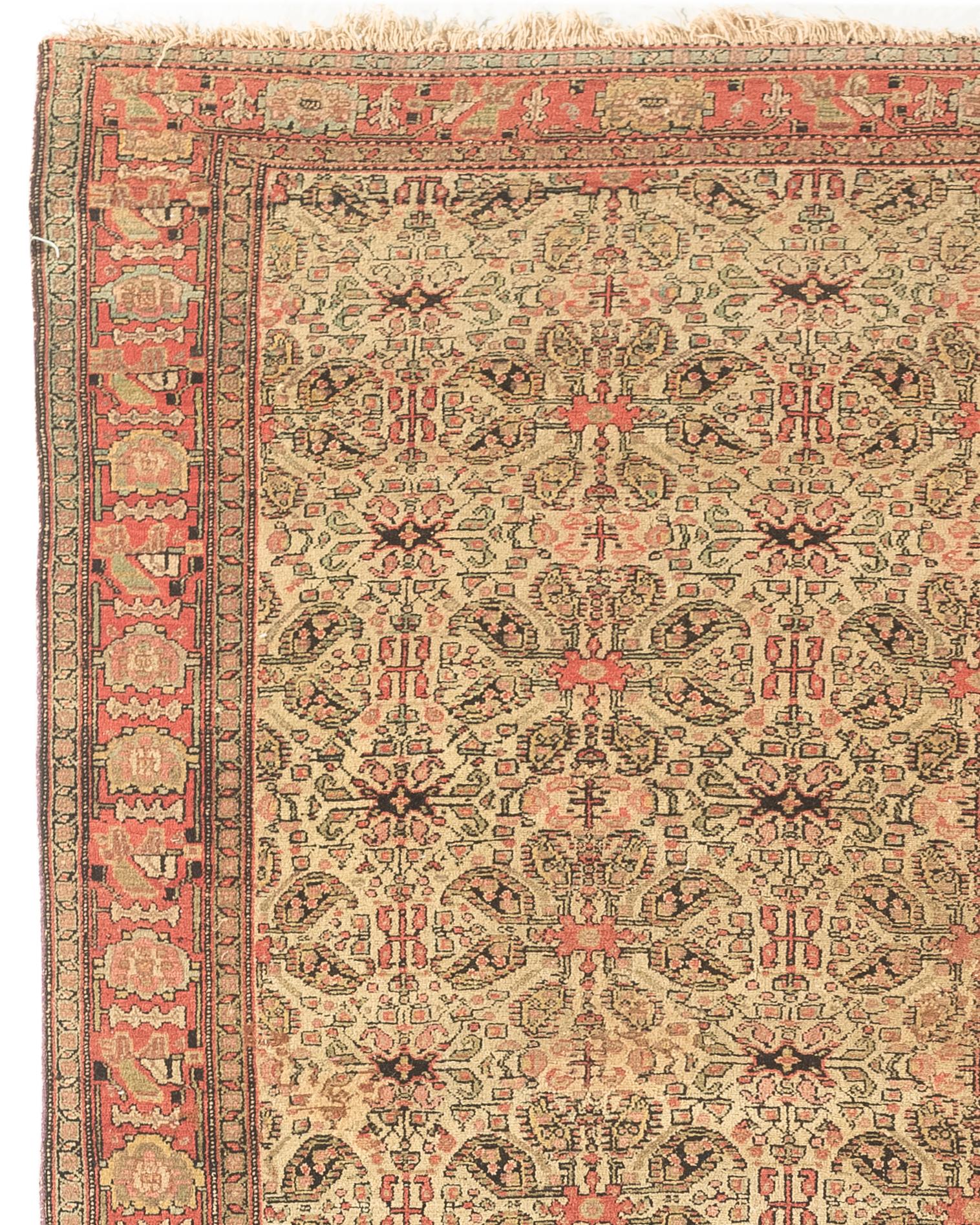 Antique Persian Senneh rug, circa 1900. From the town of Senha (Sanandaj) in Kurdistan come antique rugs that attain nearly miraculous fineness and suppleness. The wonderful main field in a light beige color full to overflowing is surrounded by a