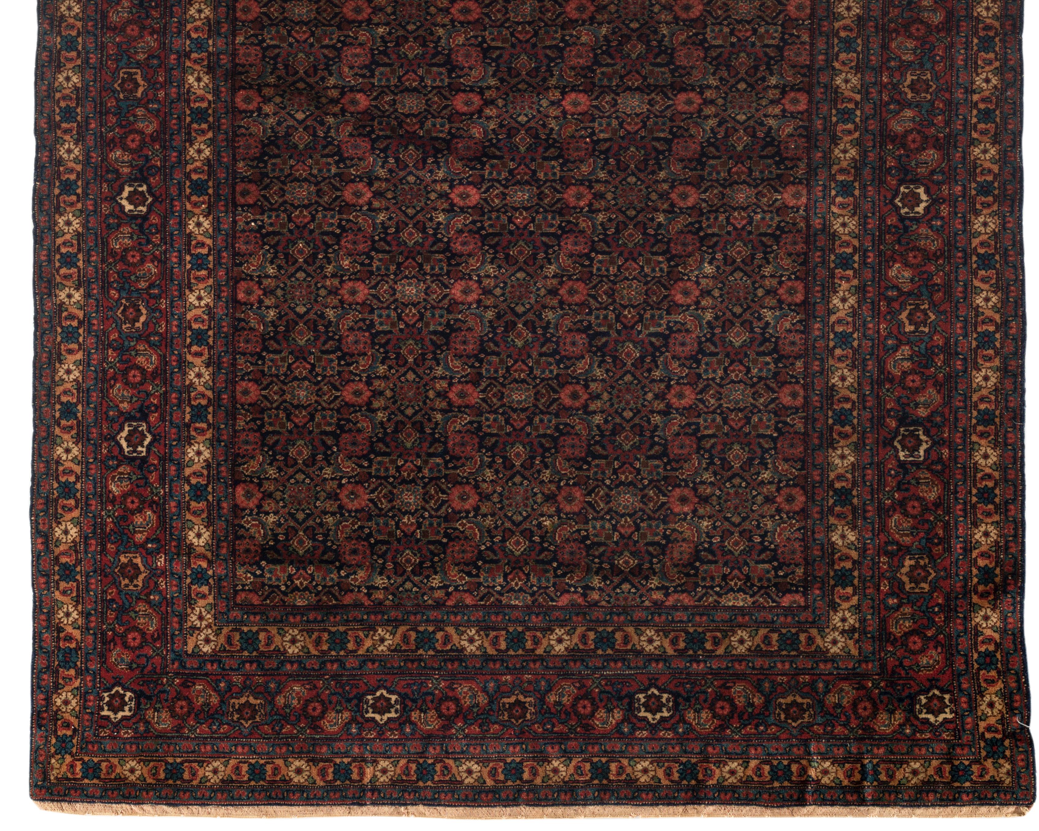 One of a pair of antique Senneh rugs, circa 1900. From the town of Senha (Sanandaj) in Kurdistan come antique rugs that attain nearly miraculous fineness and suppleness. And they are rugs, almost never room sizes or runners. The attention to detail