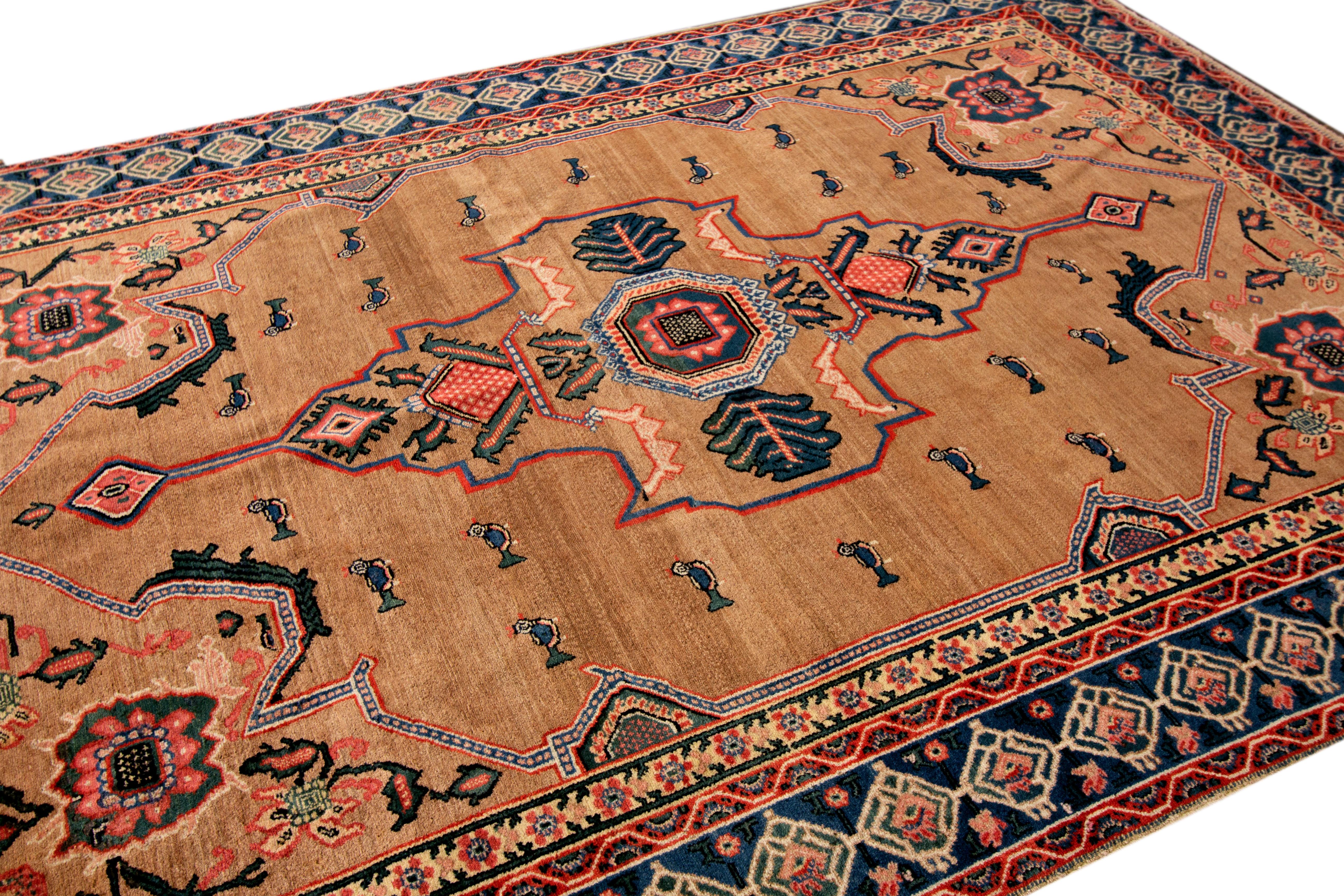 An antique Persian Sennah rug with a medallion geometric. This piece has fine details, great colors, and a beautiful design. It would be the perfect addition to your home. This rug measures 4'9