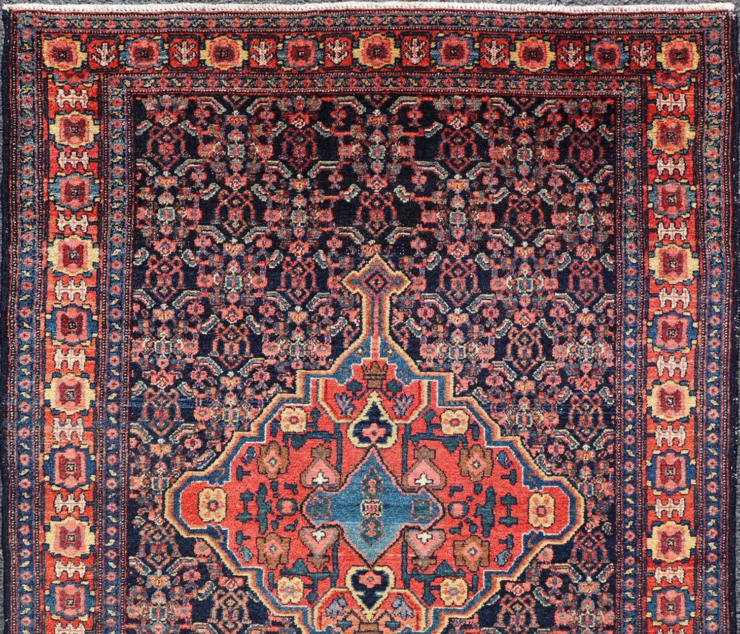 Wool Antique Persian Senneh Rug with Unique Medallion and All-Over Design For Sale
