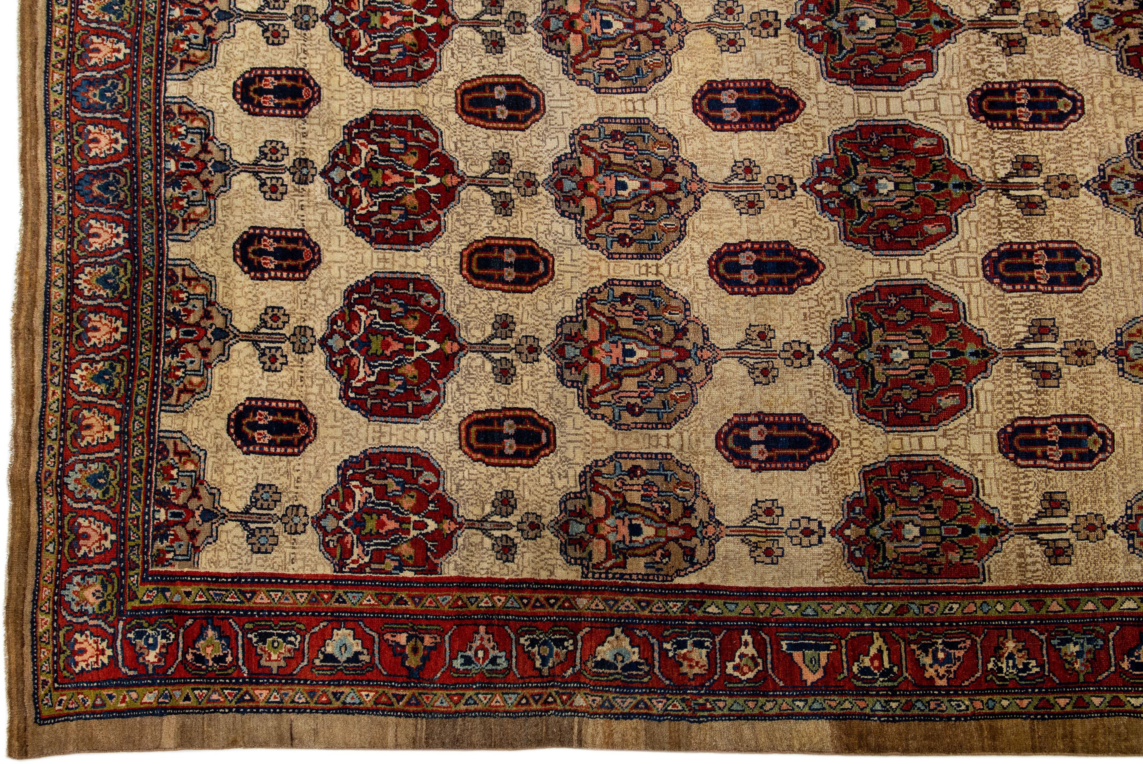 Antique Persian Serab hand-knotted wool rug with a brown color field. This piece has rust and blue accents in a beautiful classic palmettes motif.

This rug measures: 10'5