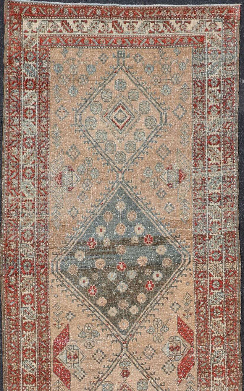 Serab antique runner from Persia with geometric medallions and ornate multi-tiered border, rug EMB-8544-178962, country of origin / type: Iran / Serab, circa 1910.

This antique Serab carpet from 1910s Persia features a traditional medallion design