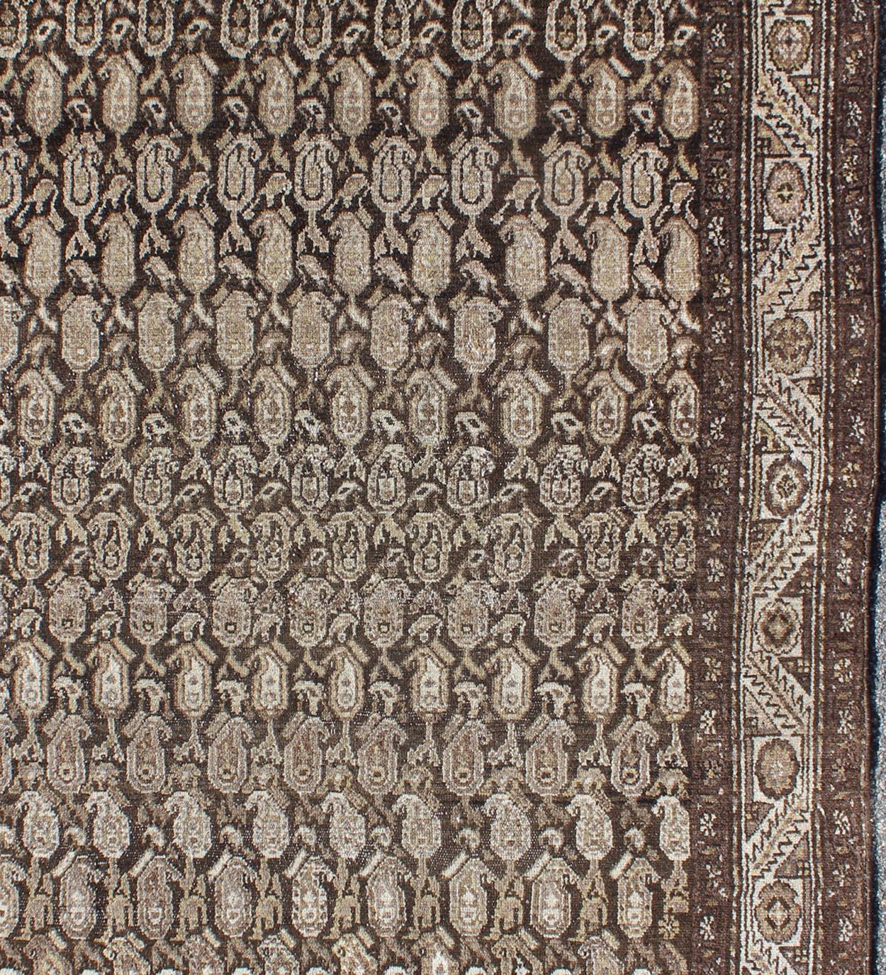 Antique Persian Seraband rug with all-over tribal design in shades of brown, rug 17-0703, country of origin / type: Iran / Seraband, circa 1910

This antique Persian Seraband rug features an all-over tribal pattern set on a variegated brown