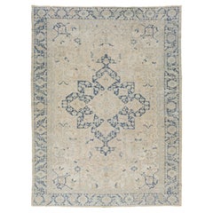 Antique Persian Serapi Beige and Blue Wool Rug Featuring a Medallion Design
