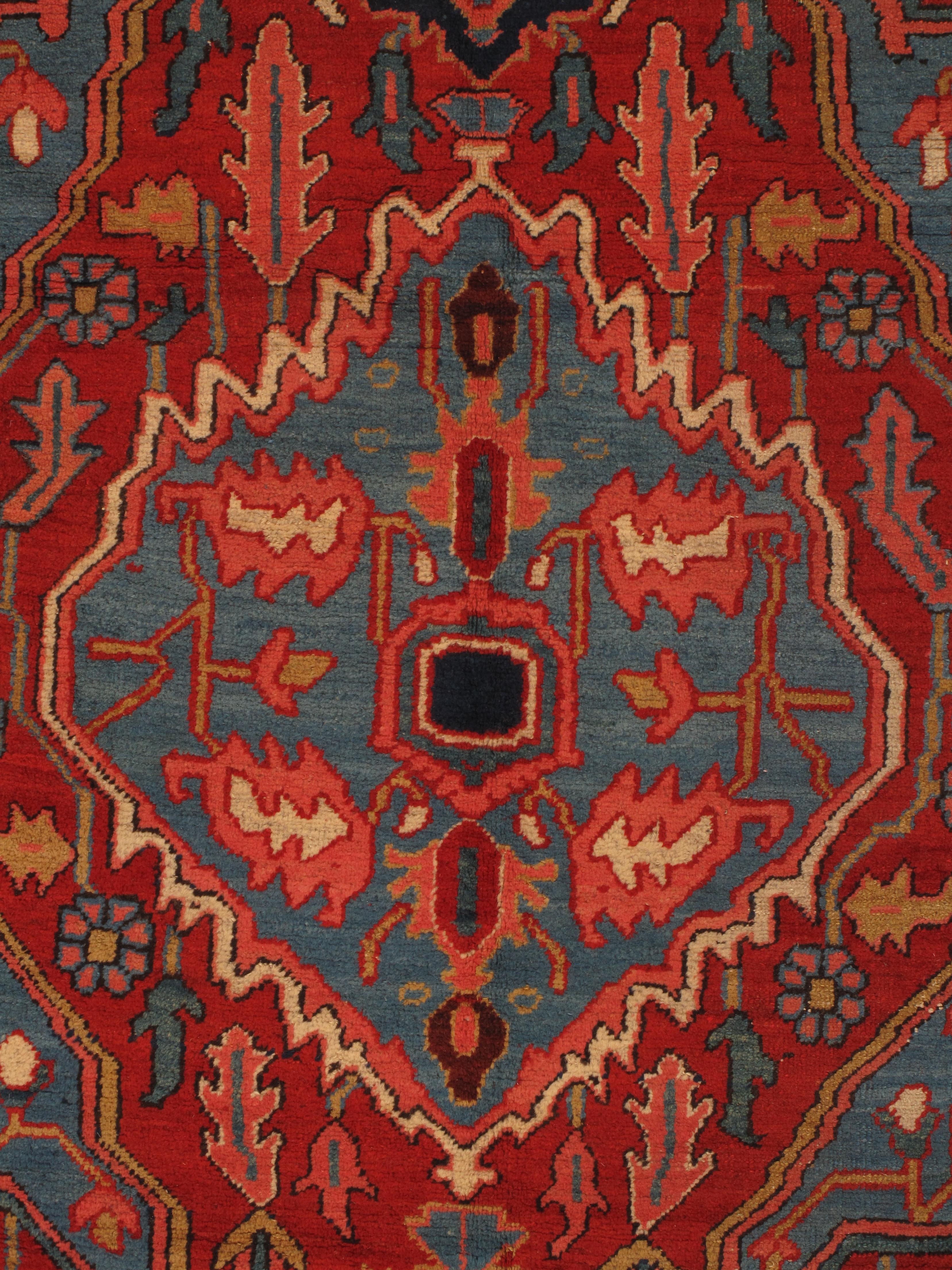 Late 19th and early 20th-century Serapi rugs represent a pinnacle of artistic achievement in Persian carpet weaving. Originating from the Serab village in the Heriz region of Northwest Persia (now Iran), these rugs are renowned for their bold,