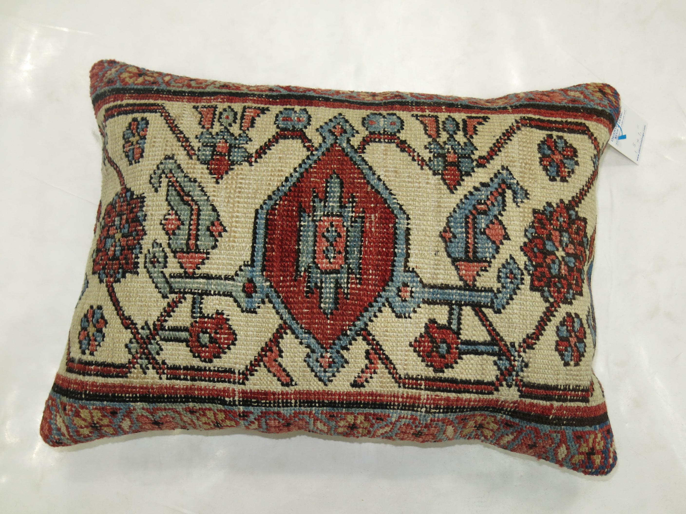 Pillow made from a fine quality Persian Serapi rug. Ivory Medallion with red brick , blue and brown accents

Measures: 17