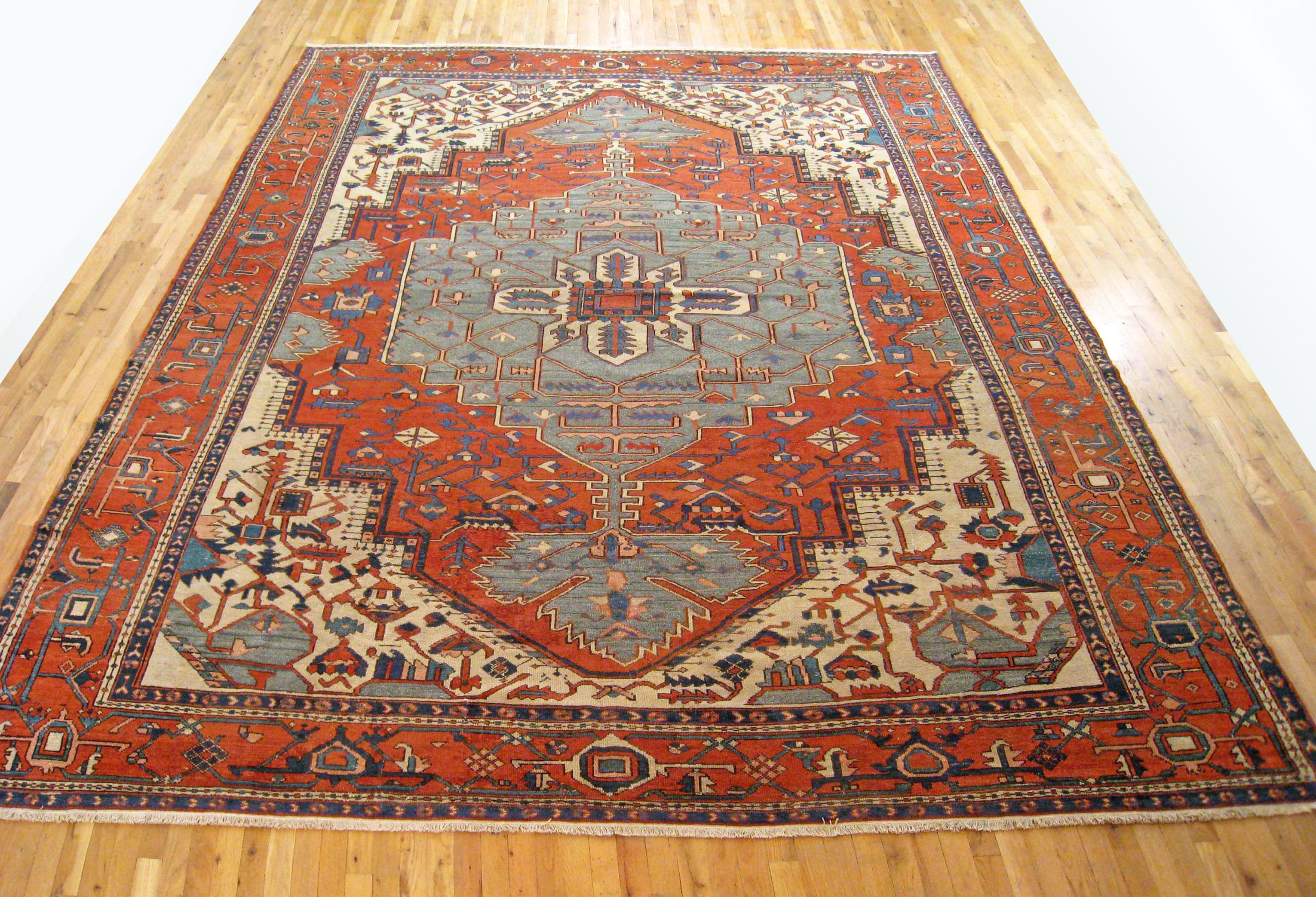 Antique Persian Serapi oriental rug, in large size

An antique Persian Serapi oriental rug, size 13'5