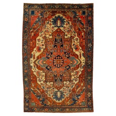 Antique Persian Serapi Red Wool Rug Featuring a Medallion Design