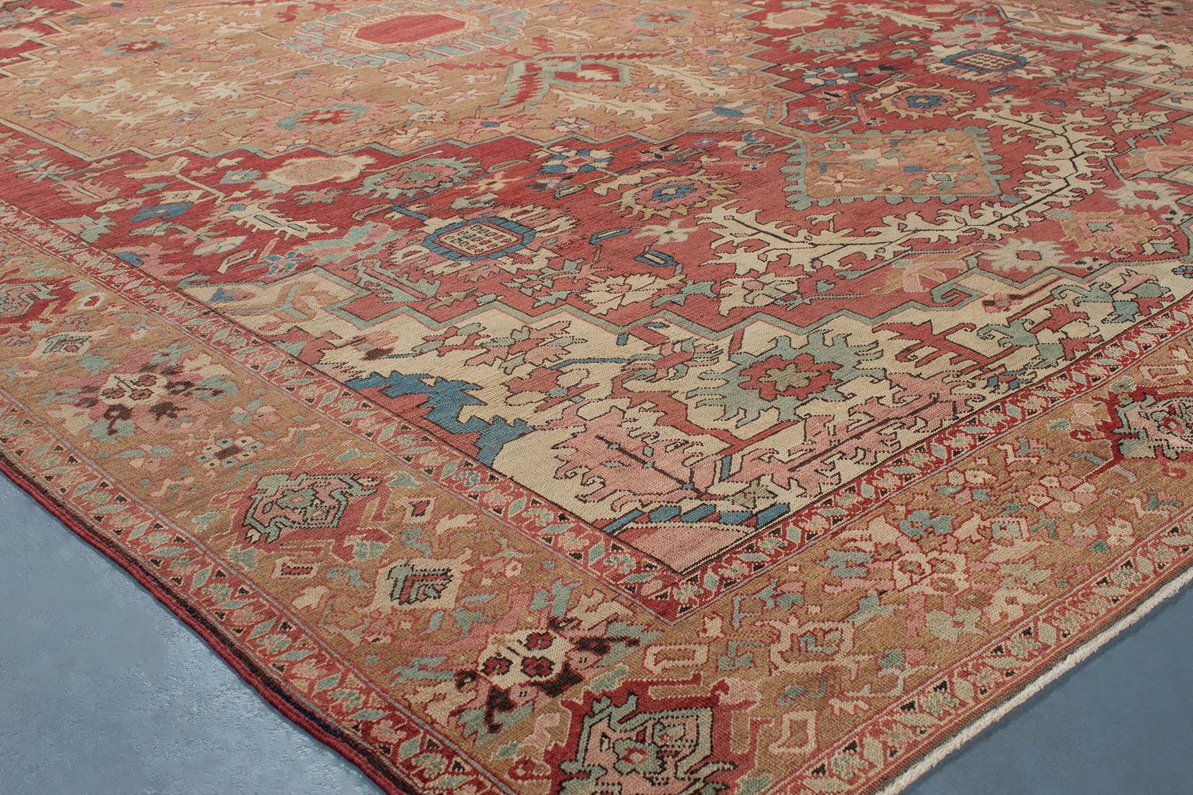 Antique Serapi rugs originated in Northwest Iran and are characterized by their finer weave with large-scale, spaciously placed designs. The majority of antique Serapis have medallions, but they can also be found with large-scale allover patterns.