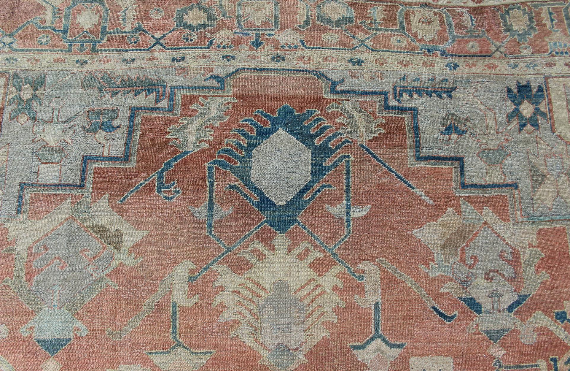 Wool Antique Persian Large Serapi Rug in Soft Red, Taupe, Light Teal and Blue For Sale