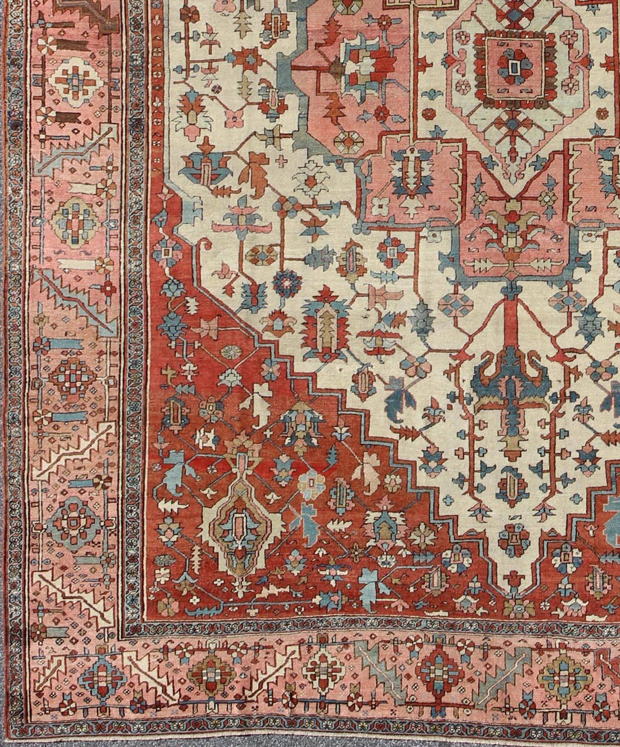 Antique Persian Serapi rug in squared shape with colors ivory, salmon pink, brick red. keivan Woven Arts /  rug 16-0608, country of origin / type: Iran / Serapi, circa 1880. 
Measures: 11'5 x 13'10
Serapi rugs are known as the finest rugs produced