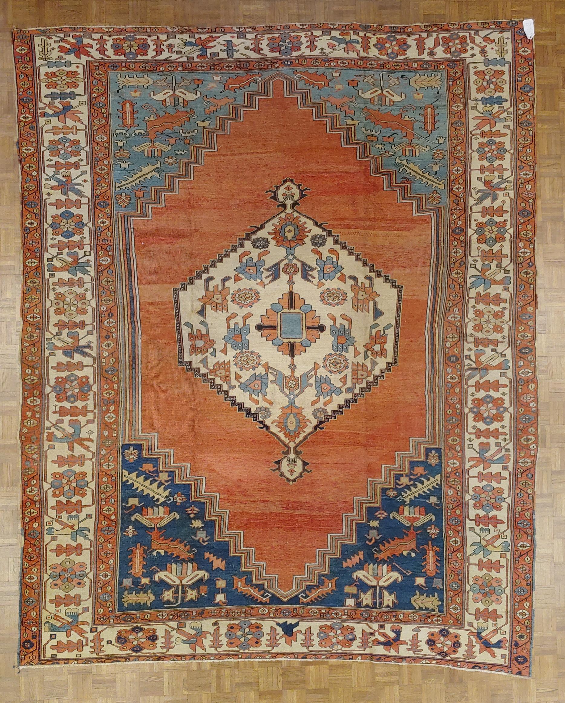This is an unusual and very striking early Persian Serapi or some would call it Bakshaish. It is a very early Heriz. The circa of this rug is 1870, but it could be even earlier. This rug is decorated with an ivory medallion and border and a rust