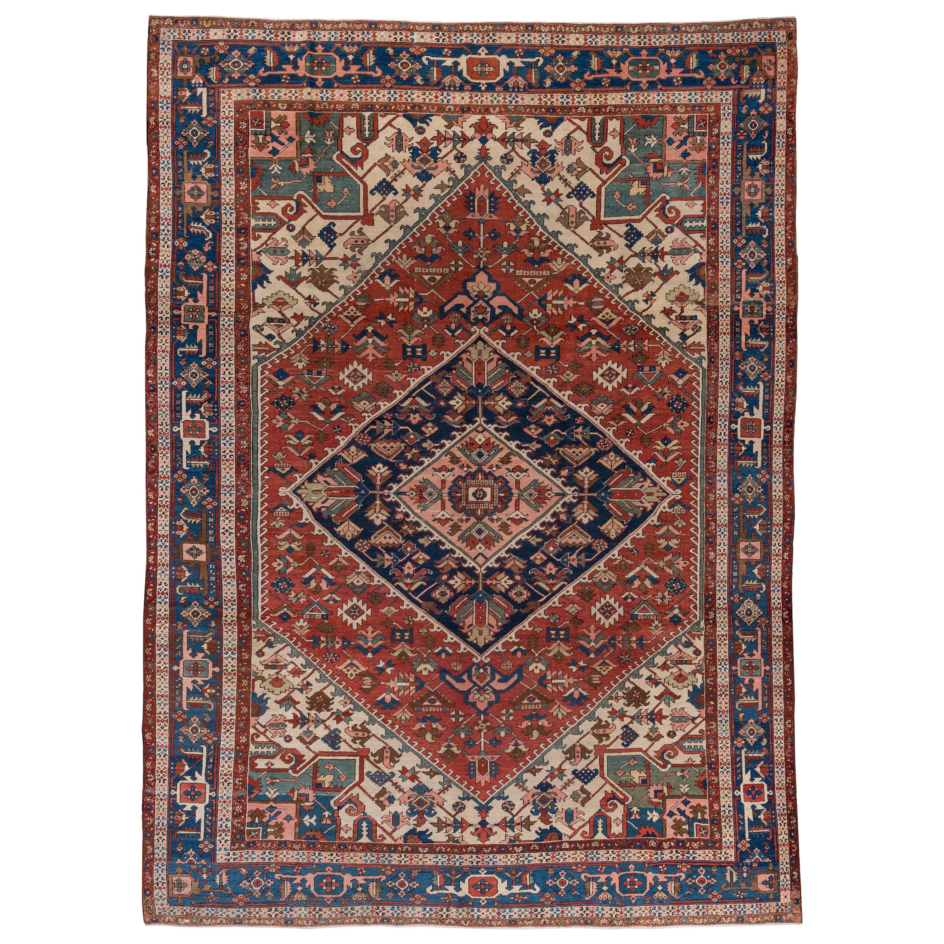 Antique Persian Serapi Rug, Rust Field, Blue Borders, Pink and Green Accents For Sale