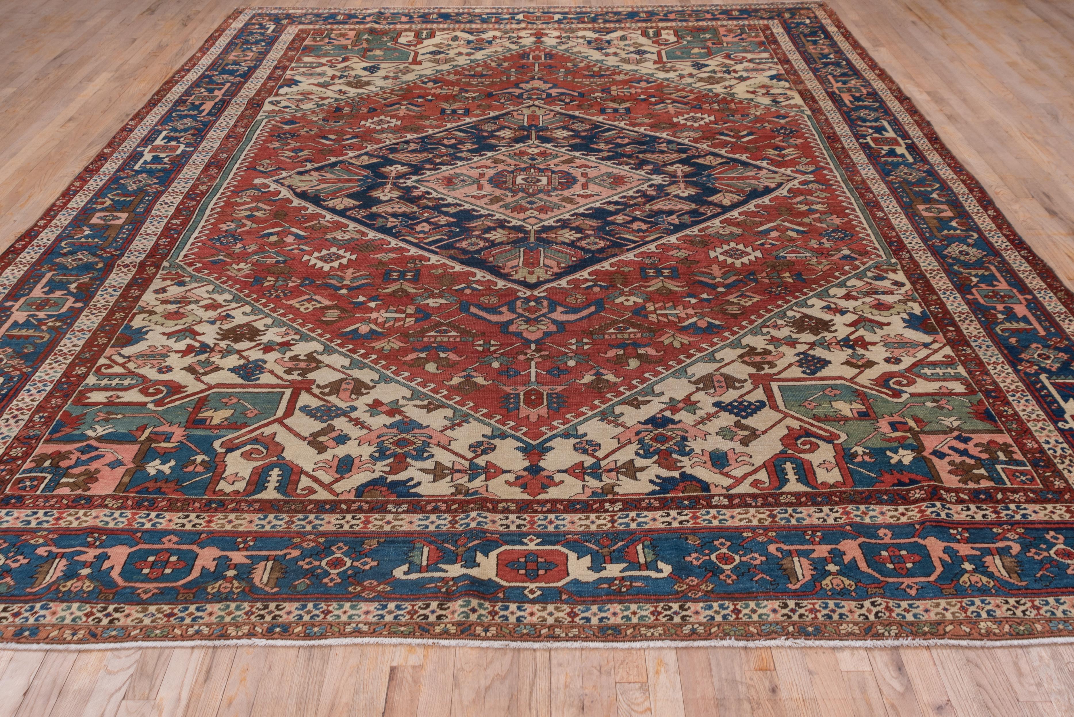 Antique Persian Serapi Rug, Rust Field, Blue Borders, Pink and Green Accents In Good Condition For Sale In New York, NY