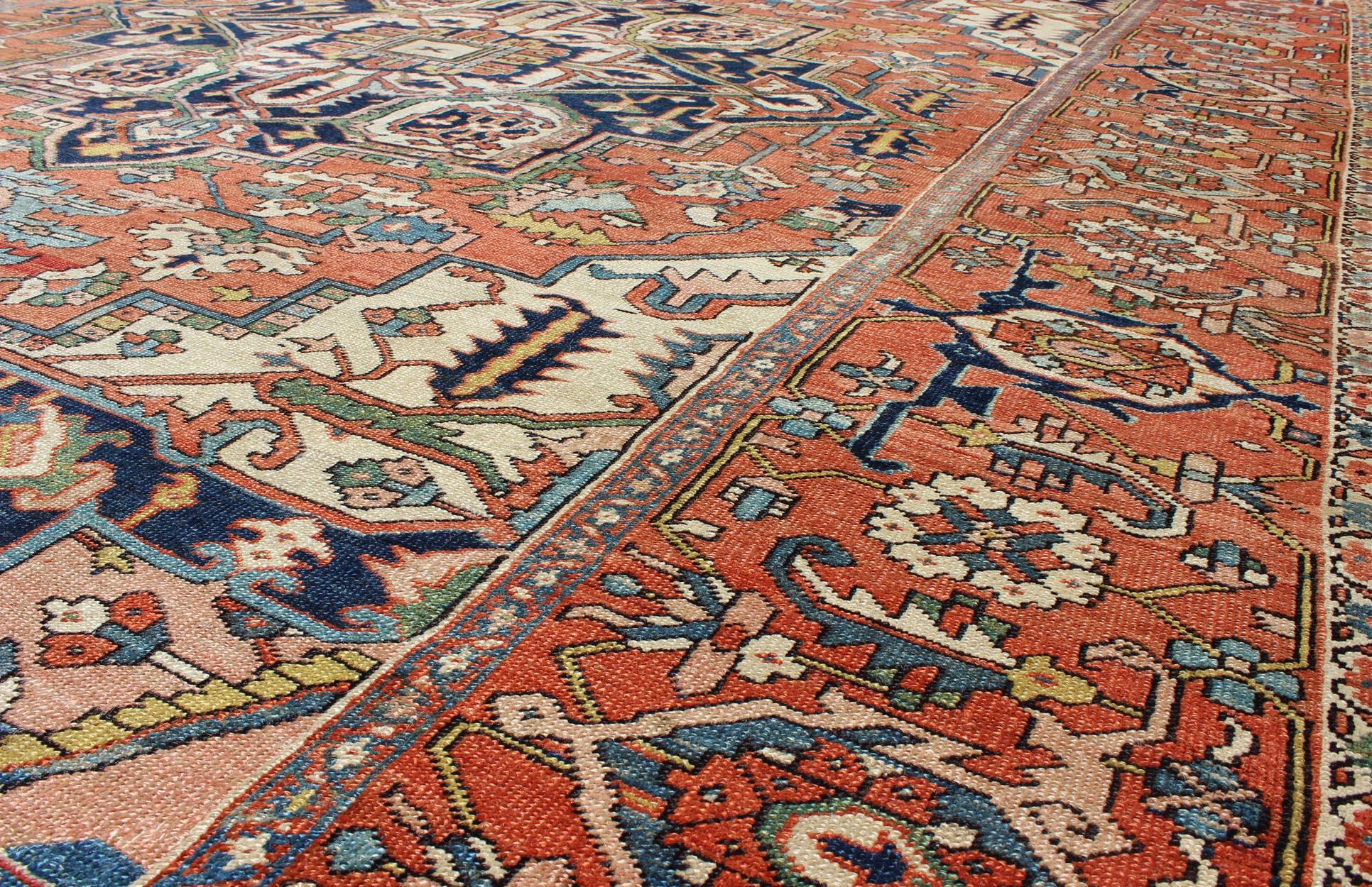 Wool Antique Persian Serapi Rug with Bold Medallion in Orange, Navy Blue and Green