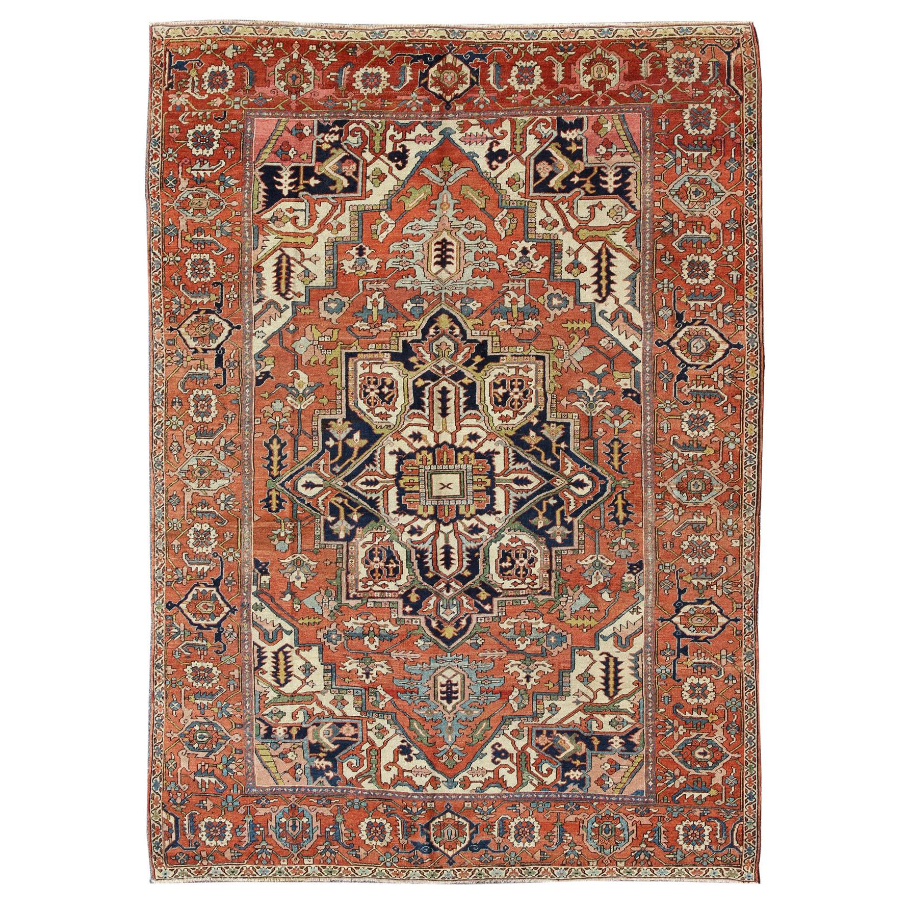 Antique Persian Serapi Rug with Bold Medallion in Orange, Navy Blue and Green