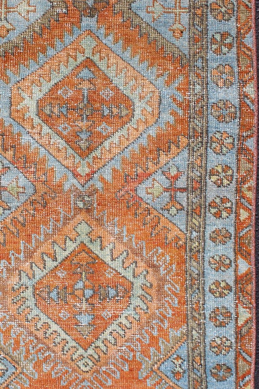 Antique Persian Serapi small rug with dual medallion design in orange and blue
Geometric medallion design Serapi antique rug, rug SUS-1909-178, country of origin / type: Iran / Serapi, circa 1900

This magnificent antique Persian Serapi carpet