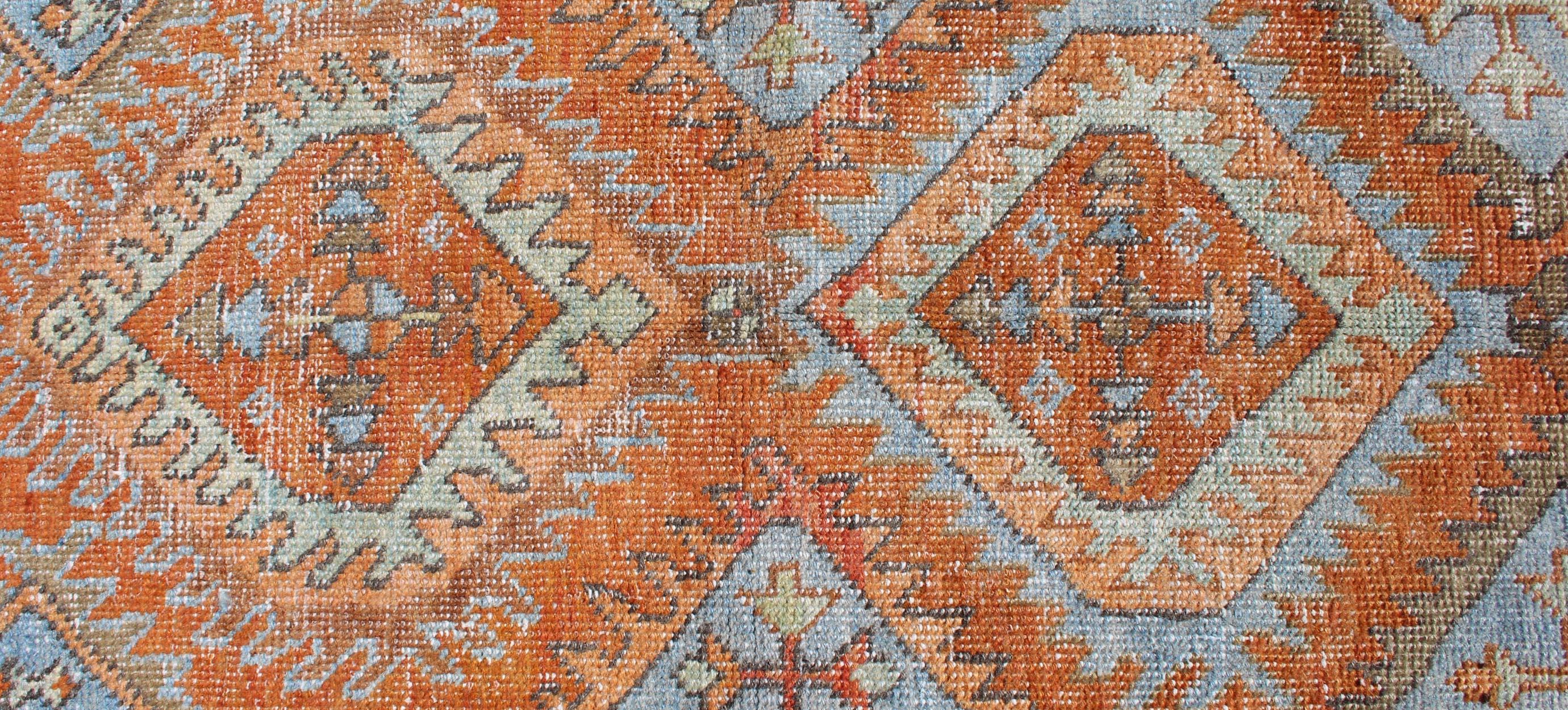 Early 20th Century Antique Persian Serapi Small Rug with Dual Medallion Design in Orange and Blue