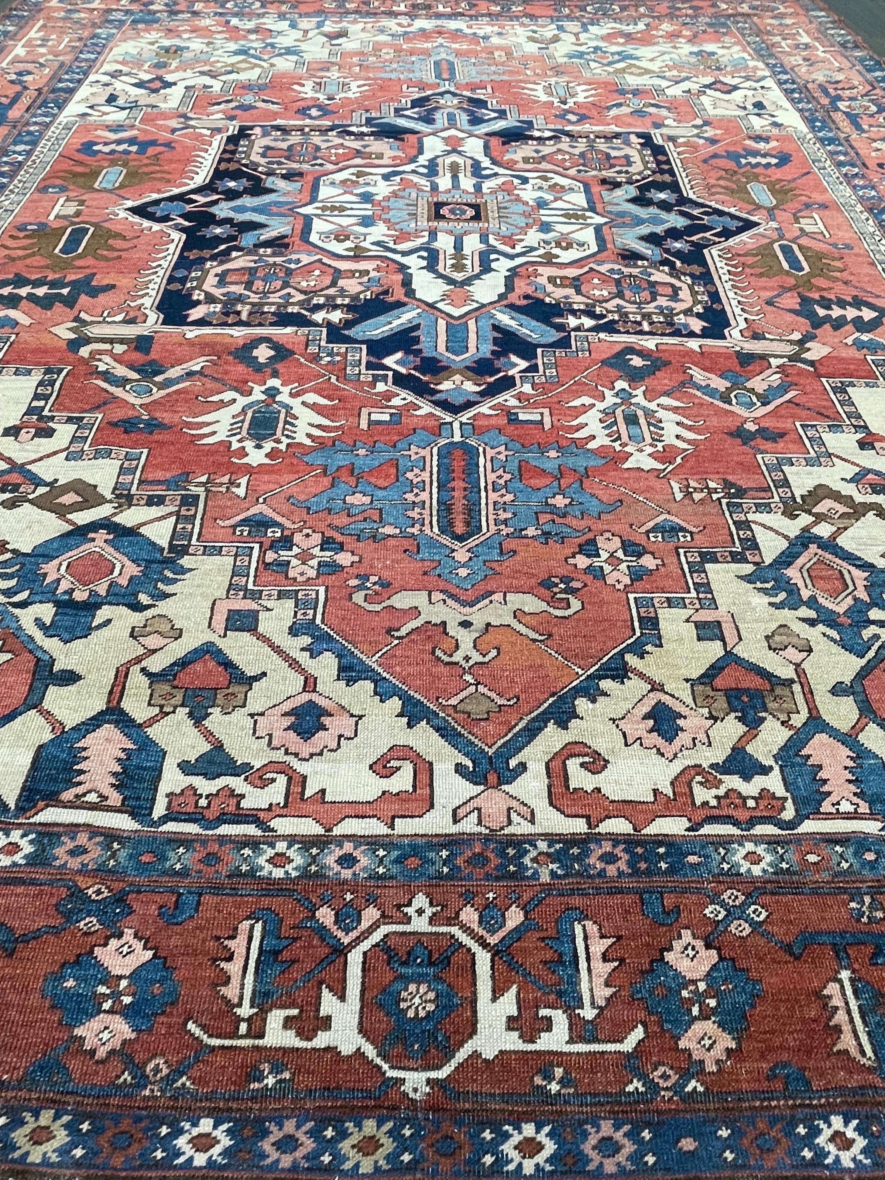 This carpet is hand woven in the northwest region of Persia in Heriz/Serapi town. Serapi carpets have a cotton warp and double-cotton weft. The wool used to make this rug is hand spun and of high quality, the dyes are all organic extracted from