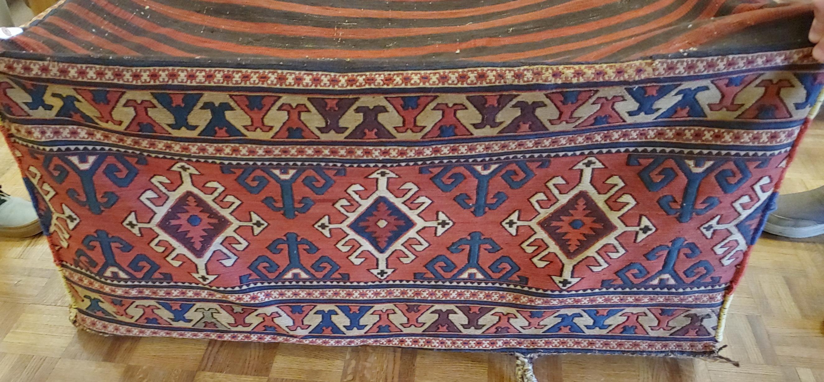 This is a Persian Shahsavan Mafrash from the Kuba district. These bags were used to store blankets & tents. The sides are flat-woven Soumak weave and the bottom is a Kelim weave. This piece is 1 &1/2 feet high by 1 &1/2 feet wide by 3&1/2 feet long.