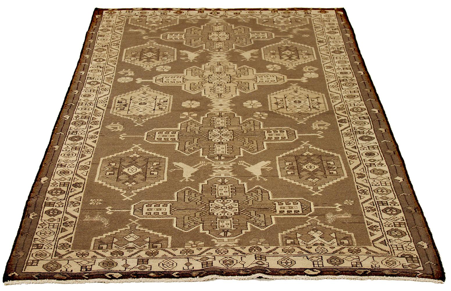 Antique Persian rug handwoven from the finest sheep’s wool and colored with all-natural vegetable dyes that are safe for humans and pets. It’s a traditional Shahsavan design highlighted by geometric tribal patterns on the centerfield. It’s a