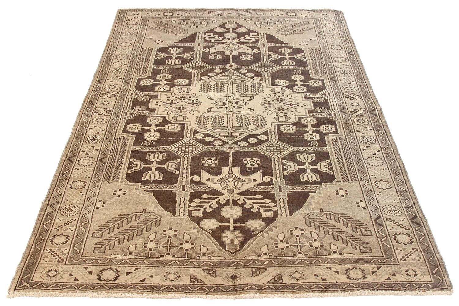 Antique Persian rug handwoven from the finest sheep’s wool and colored with all-natural vegetable dyes that are safe for humans and pets. It’s a traditional Shahsavan design highlighted by floral patterns on the brown field. It’s a beautiful piece