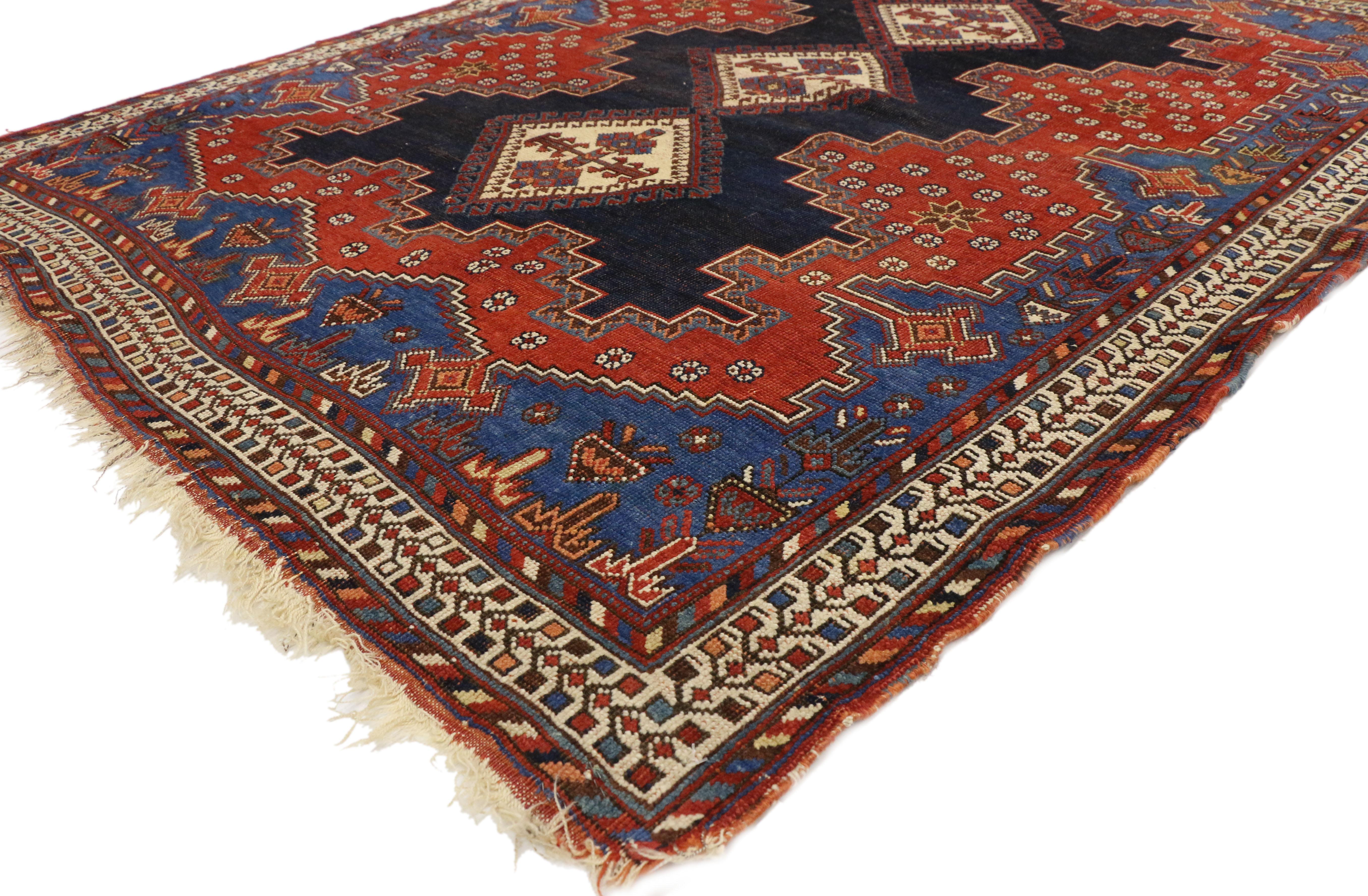 71656, antique Persian Shiraz accent rug with Modern Tribal style. This hand knotted wool antique Persian Shiraz rug with modern tribal style features a triple stacked diamond medallion with latch-hook edges in an abrashed ink blue field and