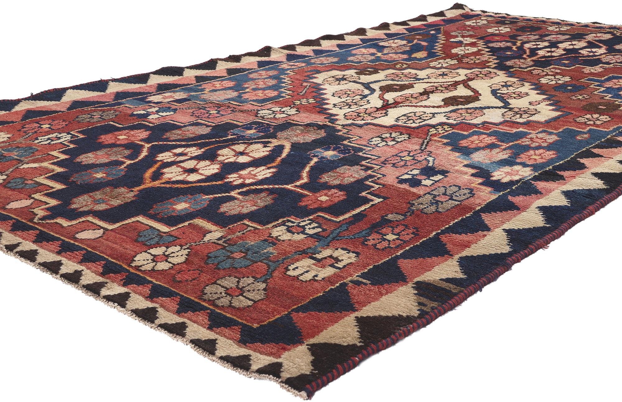 61234 Antique Persian Shiraz Rug, 04'11 x 09'00. In the rich tradition of Persian craftsmanship, this hand-knotted wool antique Shiraz rug is a breathtaking display of artistry and cultural heritage. The rug's field, bathed in a richly striated