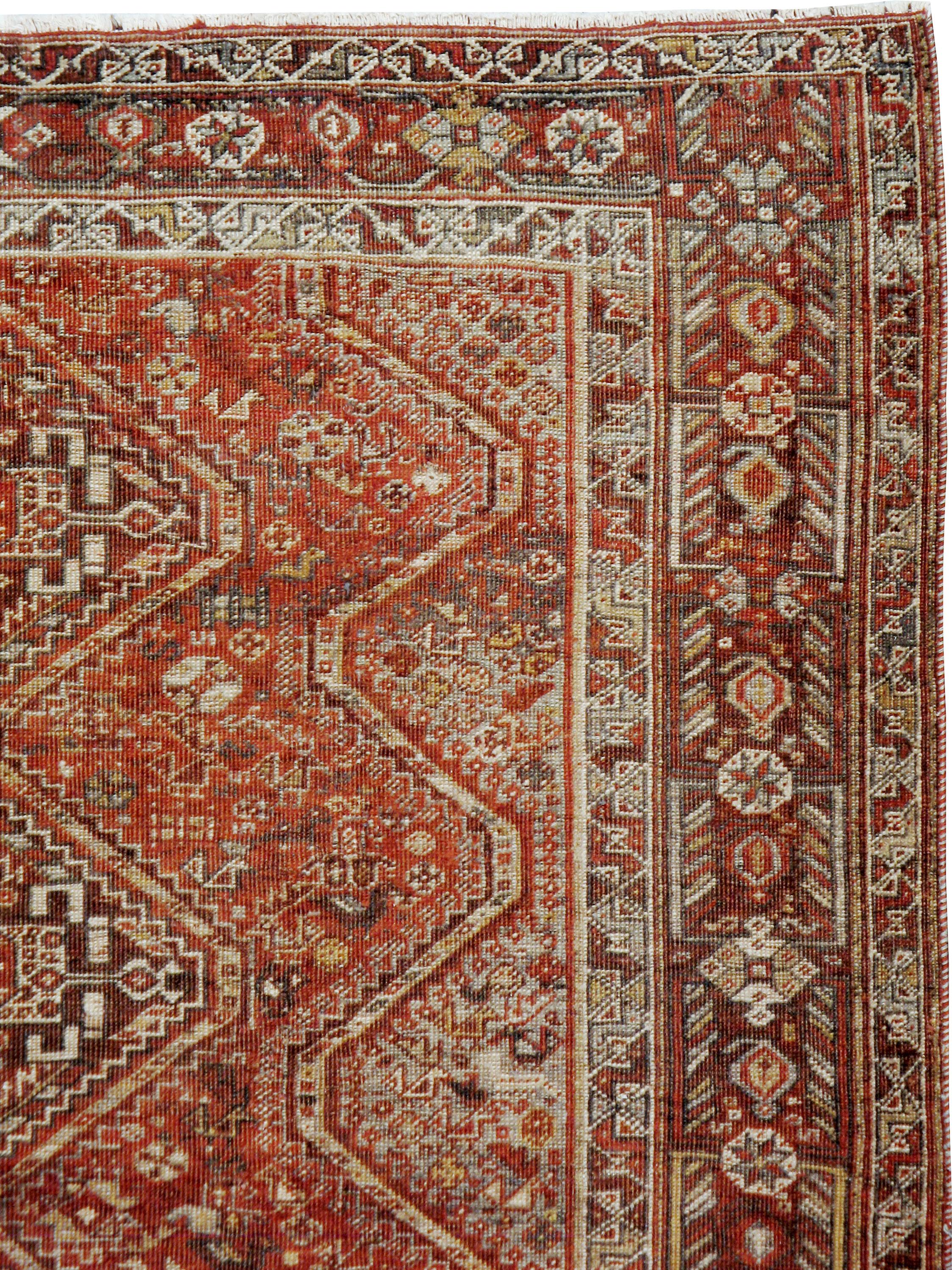 An antique Persian Shiraz rug from the early 20th century.

Measures: 5' 5