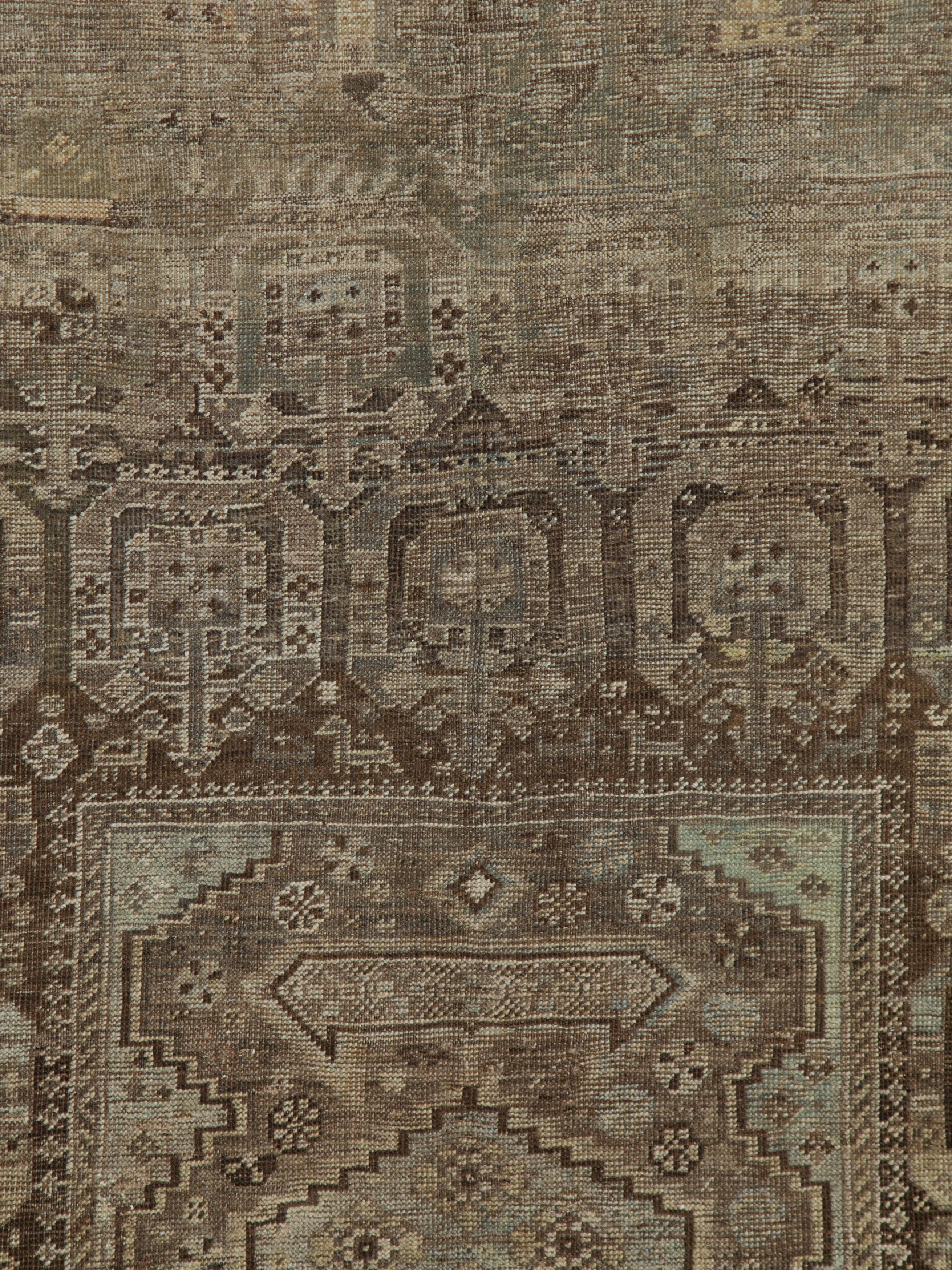 An antique Persian Shiraz rug from the early 20th century.

Measures: 5' 10