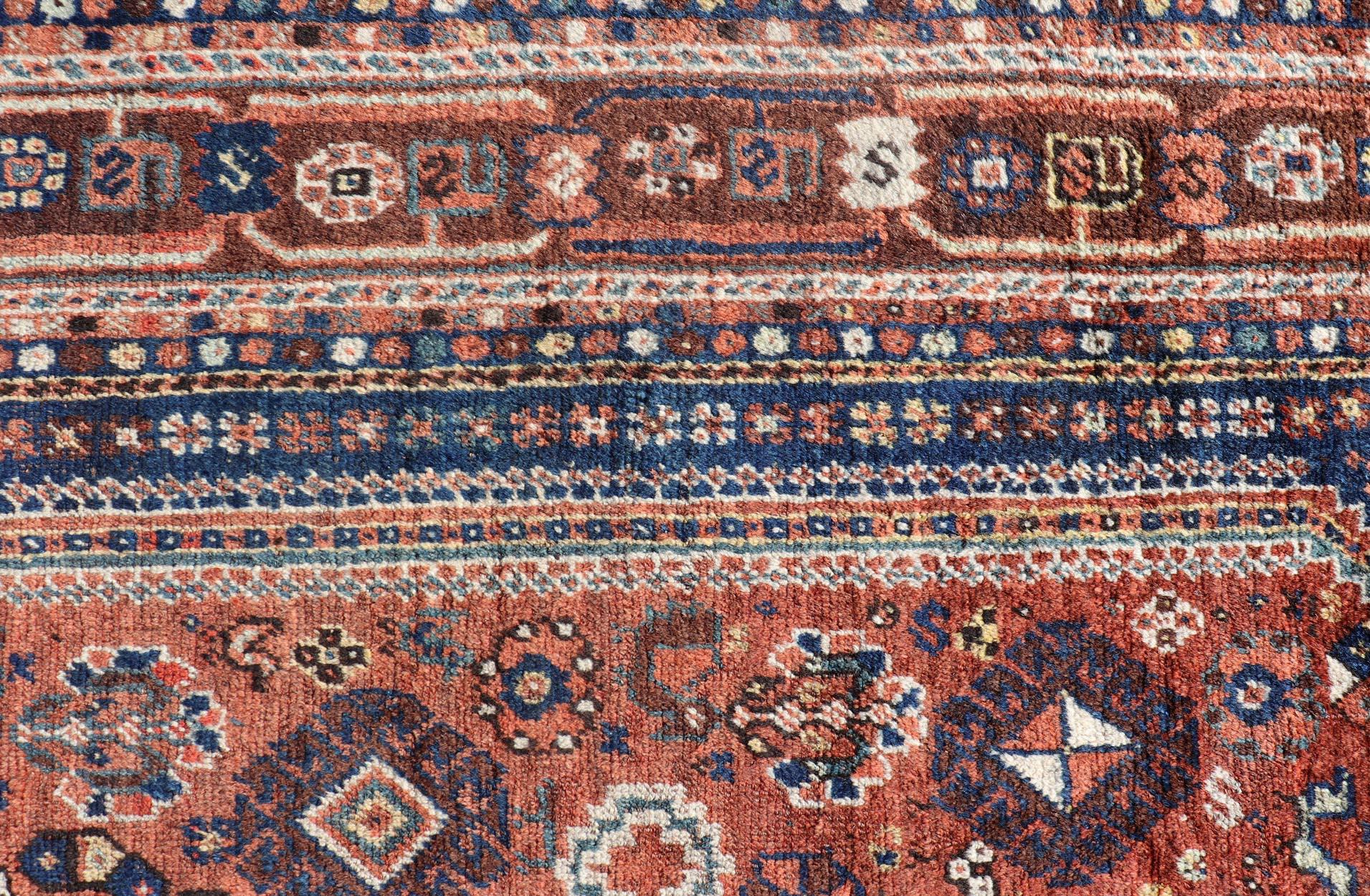 Tribal Antique Persian Shiraz Rug Tri-Medallion Geometrics in Rusty Orange and Blue For Sale
