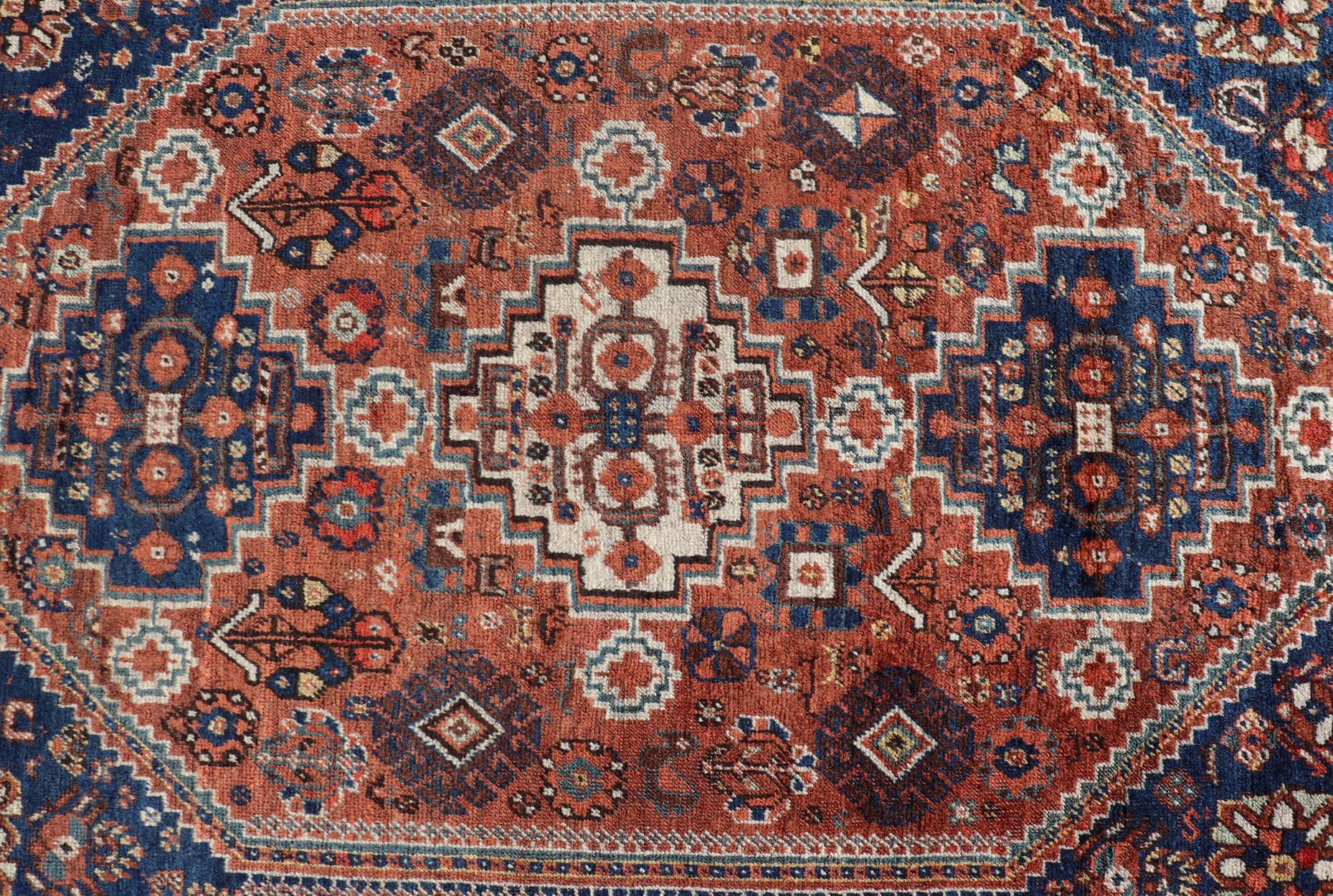 Antique Persian Shiraz Rug Tri-Medallion Geometrics in Rusty Orange and Blue In Good Condition For Sale In Atlanta, GA