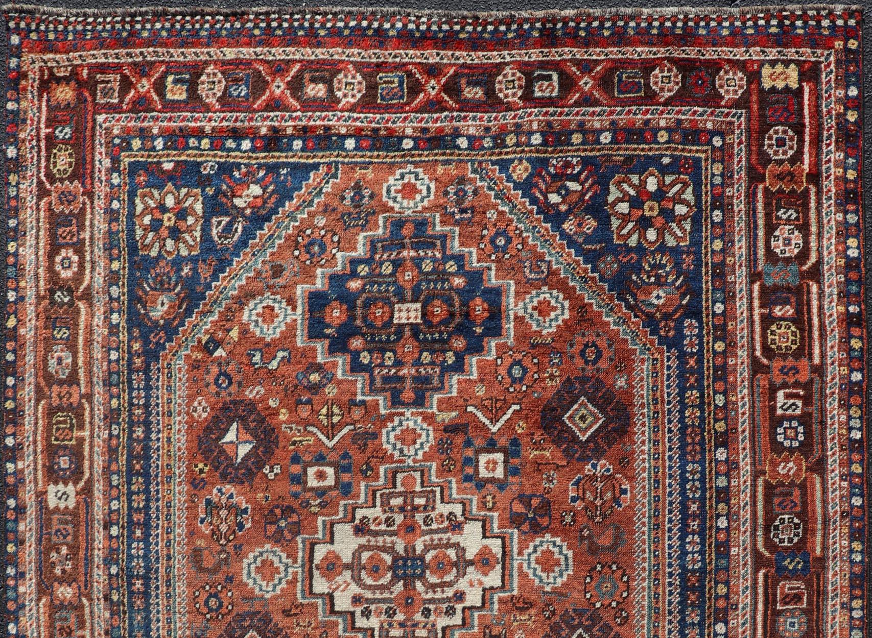 20th Century Antique Persian Shiraz Rug Tri-Medallion Geometrics in Rusty Orange and Blue For Sale