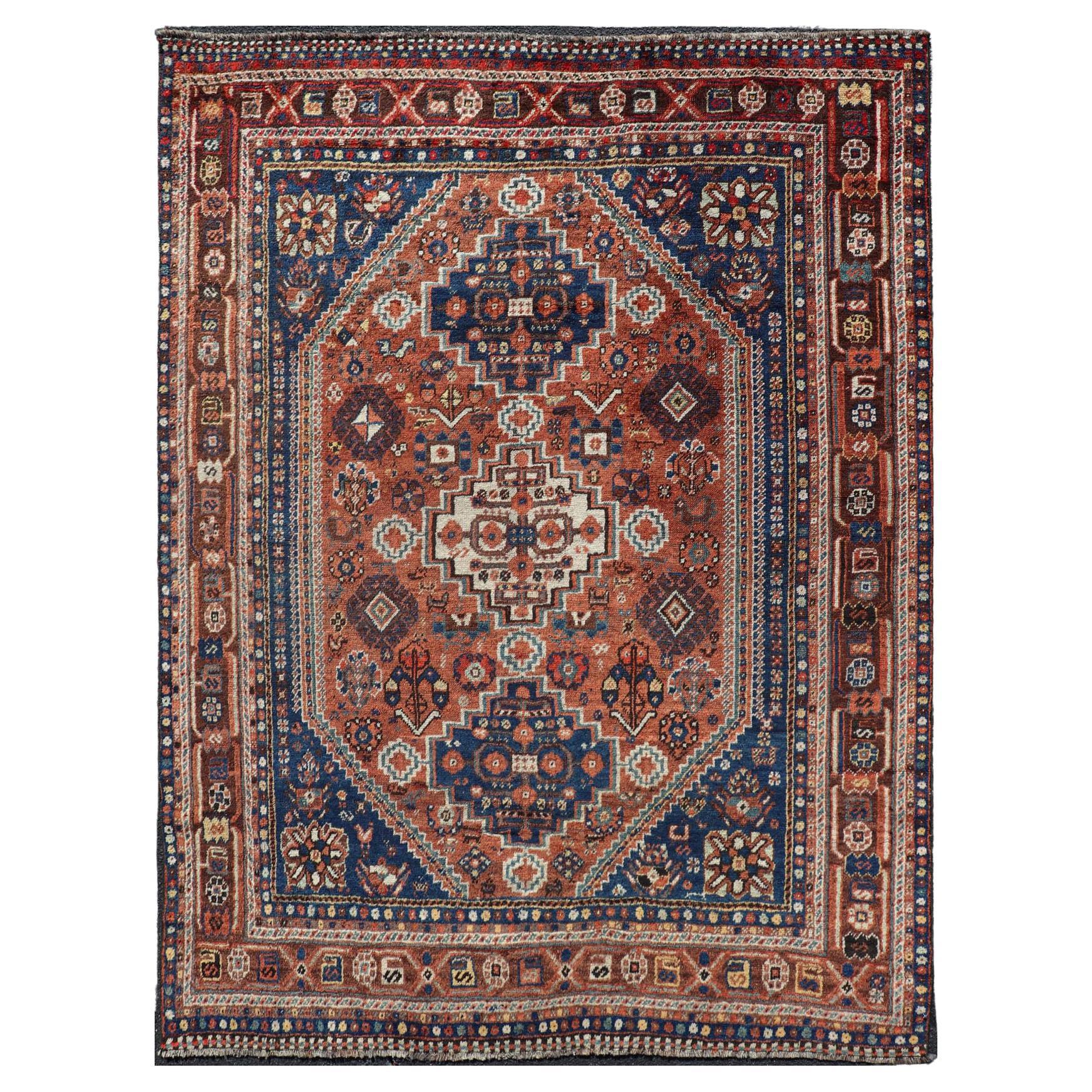 Antique Persian Shiraz Rug Tri-Medallion Geometrics in Rusty Orange and Blue For Sale