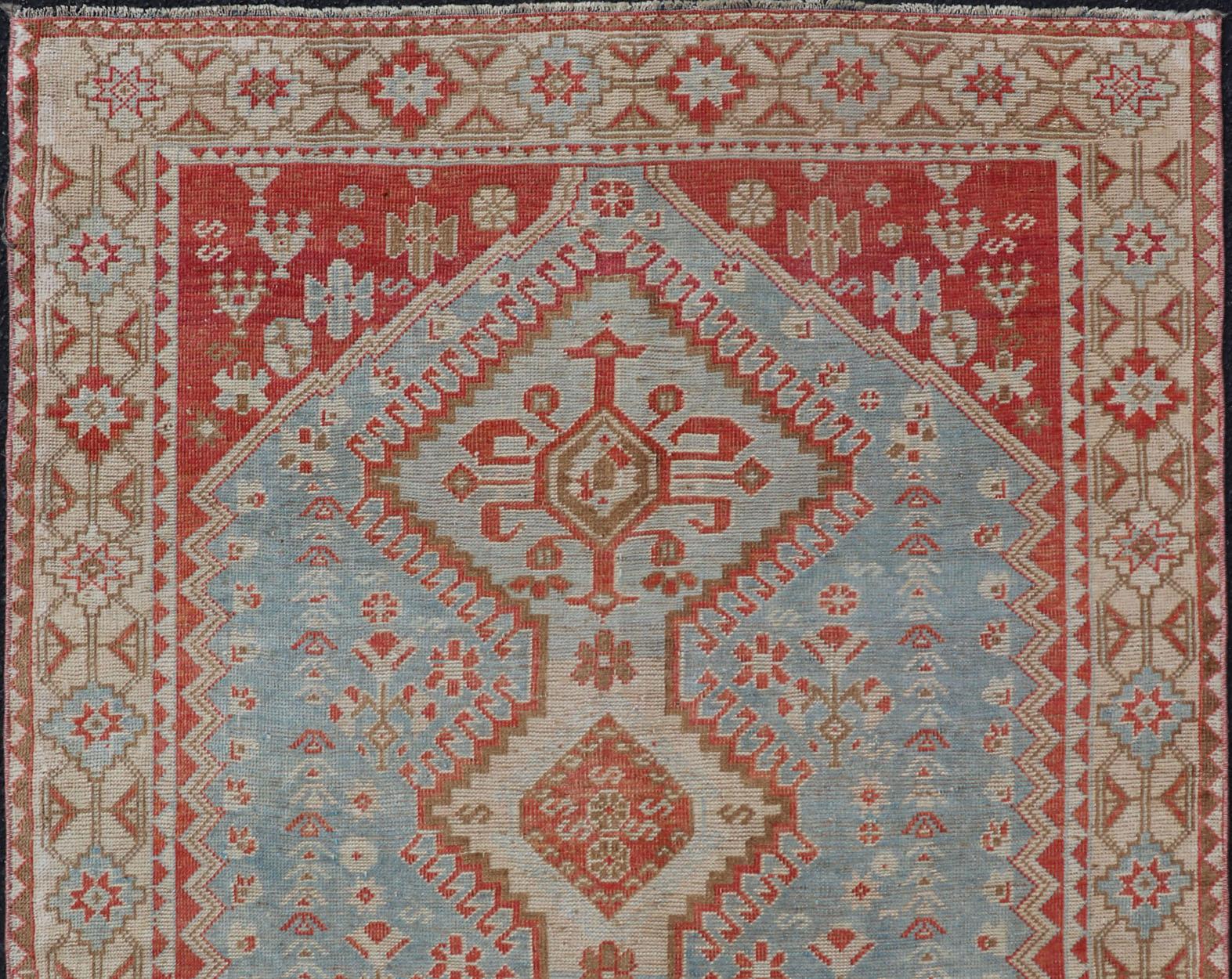 Antique Persian Shiraz rug with Center Medallions and Sub Geometric Design. Keivan Woven Arts / rug EMB-9708-P13900, country of origin / type: Iran / Shiraz, circa 1920.

This antique Persian Shiraz rug has been hand-knotted in wool and features an