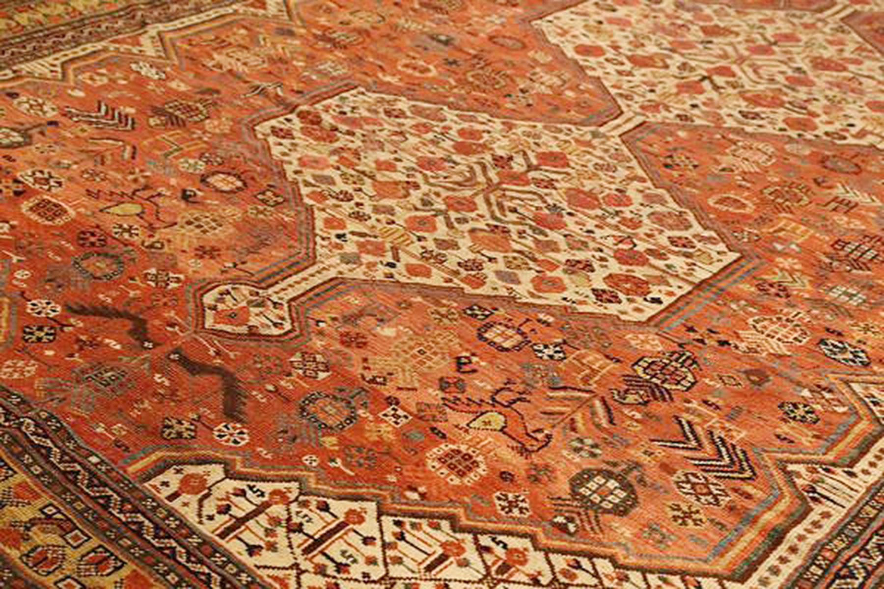 Hand-Woven Antique Persian Shiraz Rug with Ivory Floral Medallions on Orange & Beige Field For Sale