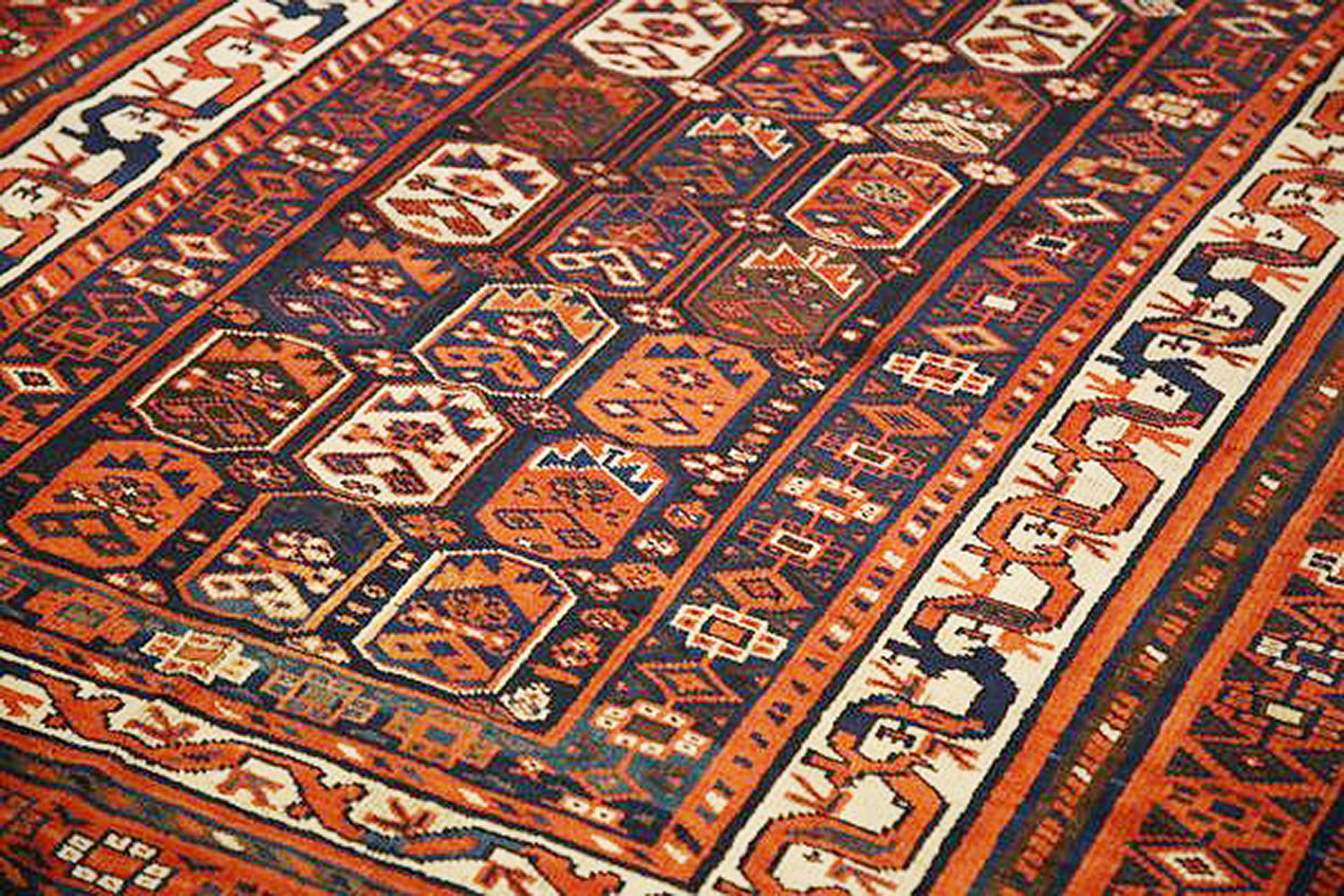 Islamic Antique Persian Shiraz Rug with Ivory and Navy Geometric Details on Rust Field For Sale