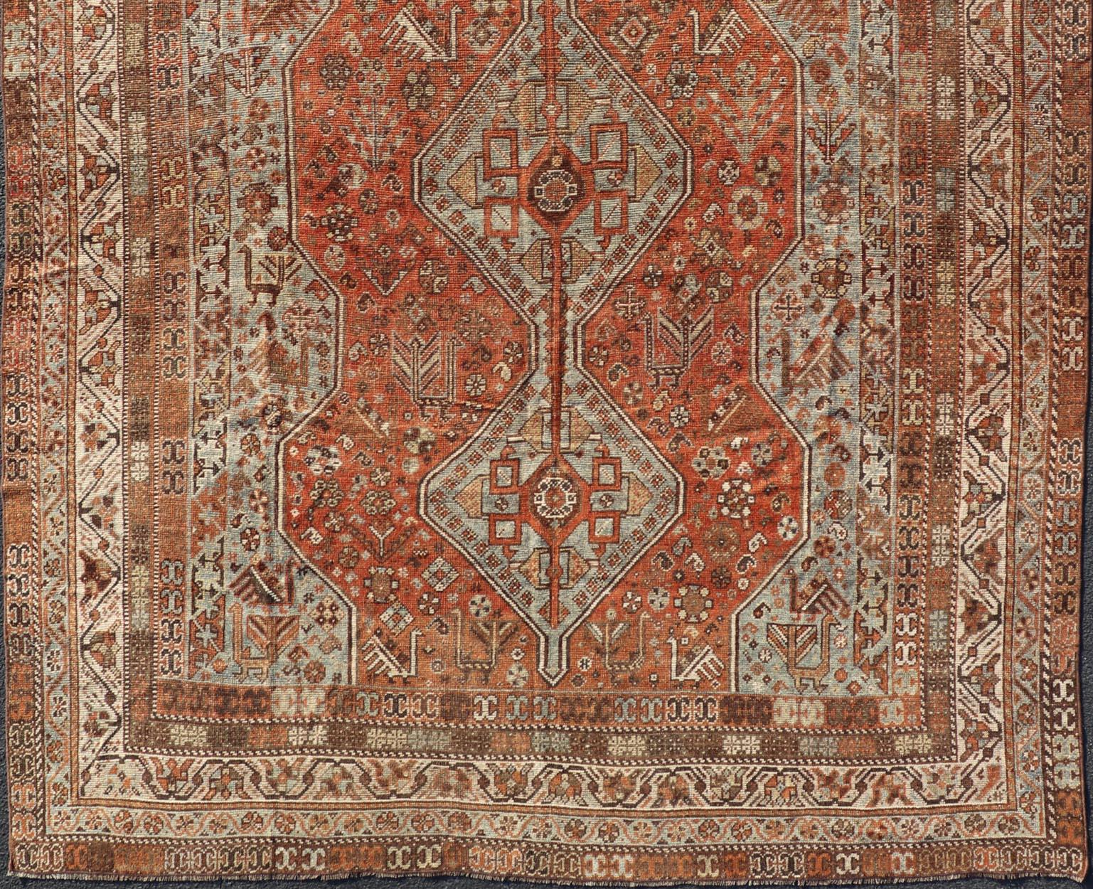 Wool Antique Persian Shiraz Rug With Medallions Geometric in Rusty Orange, Steel Blue For Sale