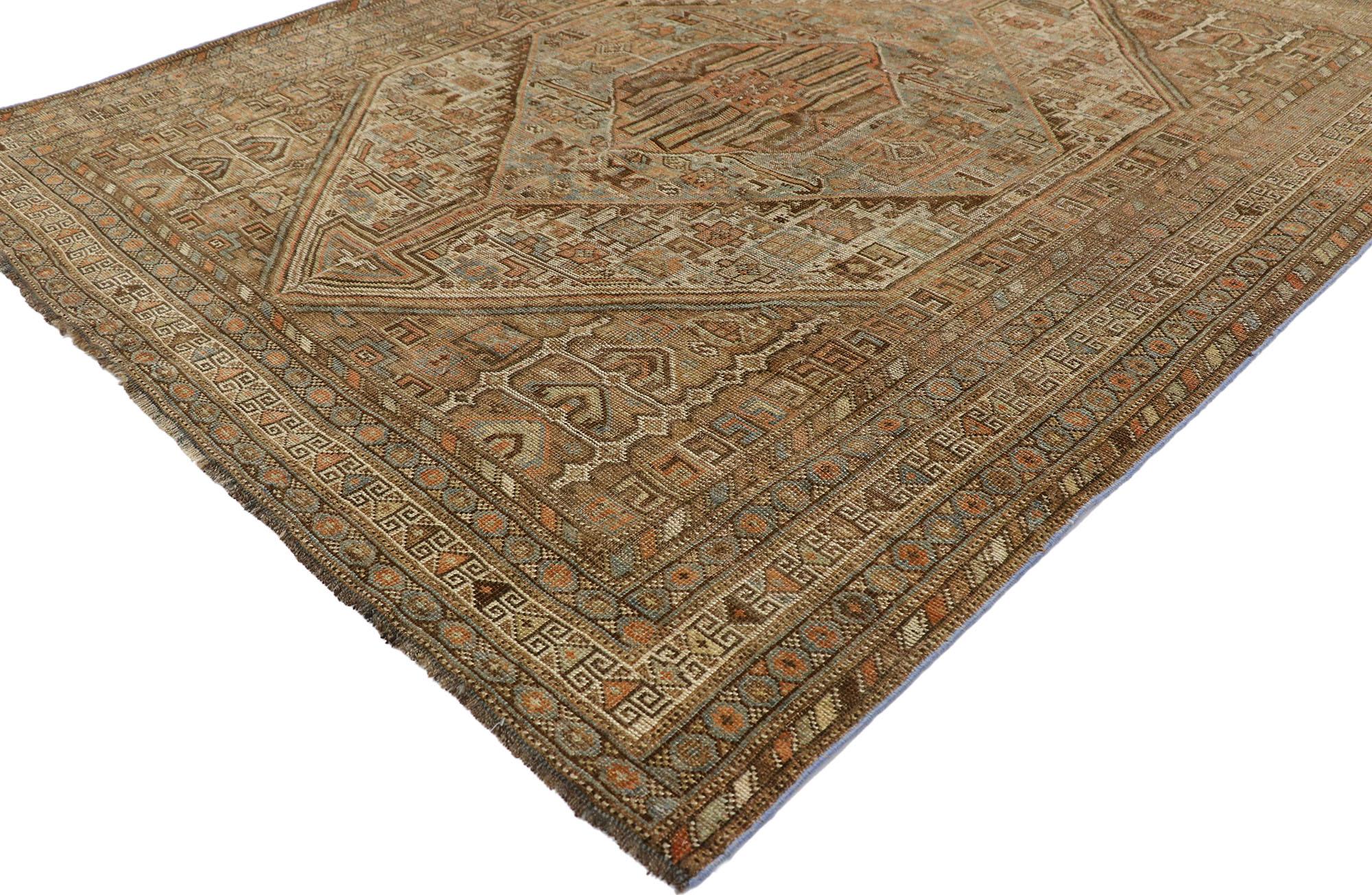 60849, antique Persian Shiraz rug with modern tribal style 05'02 x 06'02. Warm and inviting with its nomadic charm, this hand-knotted wool antique Persian Shiraz rug beautifully embodies modern tribal style. The abrashed cut-out field features a
